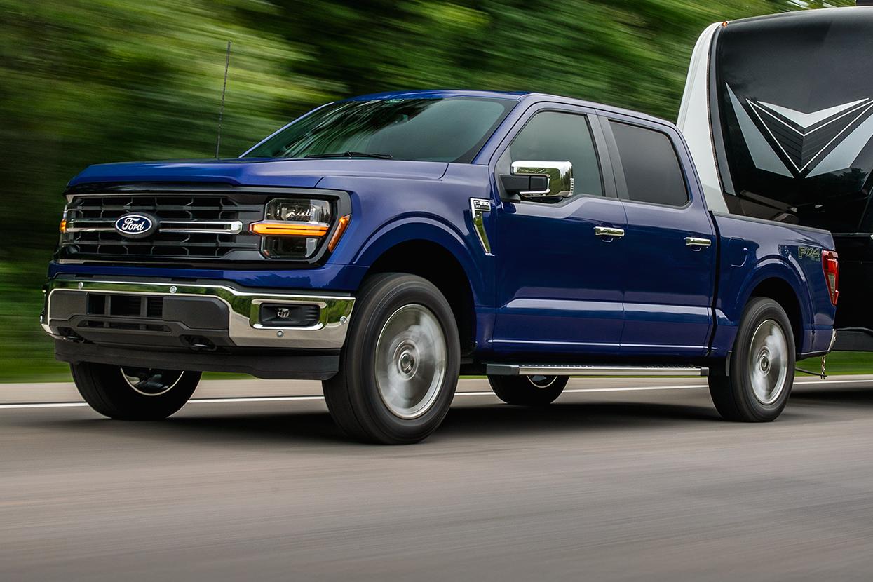 Truck month Ford F-150 towing a camper for shoppers near Benton KY