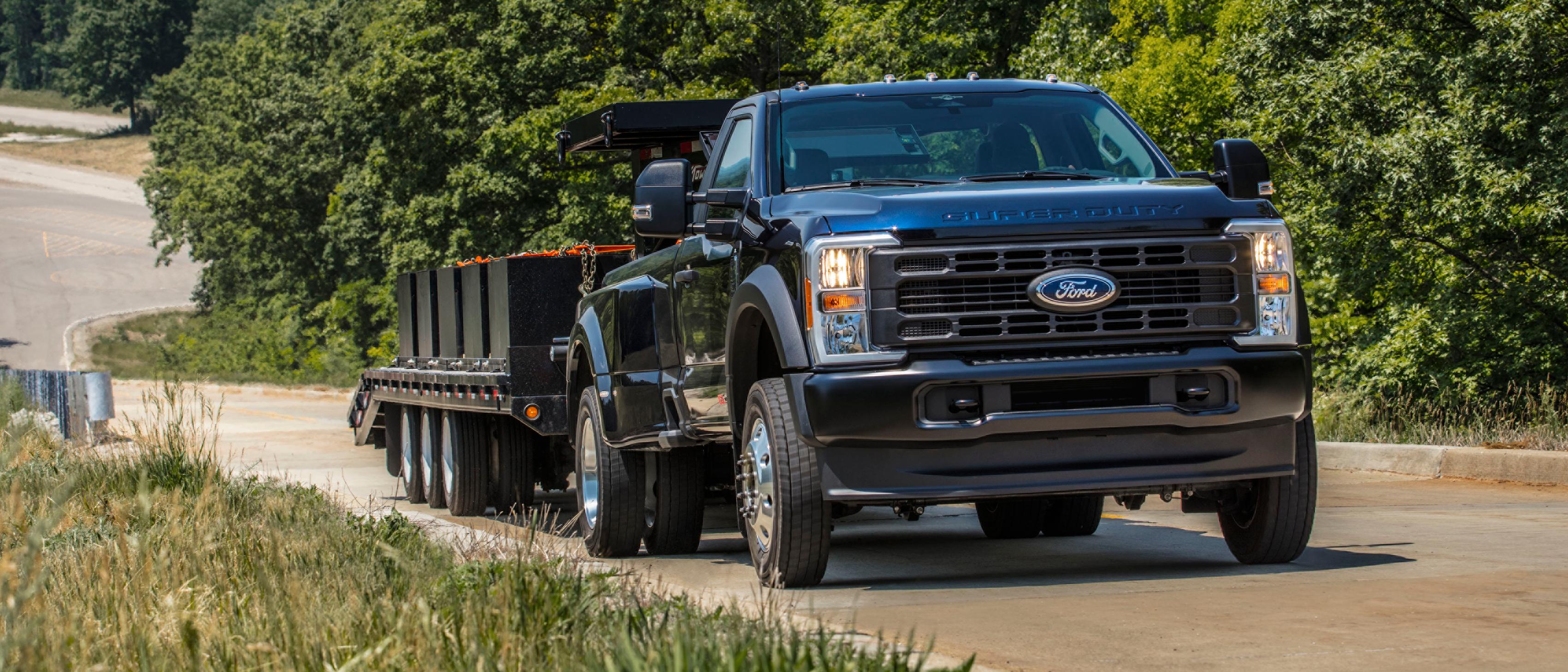 2026 Ford Super Duty towing a heavy equipment trailer near Benton KY