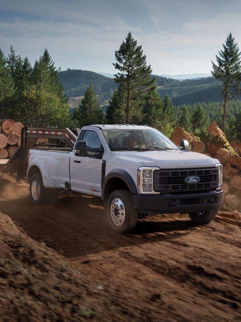 2027 Ford Super Duty® F-450® XL model with the STX® Appearance Package being driven on a dirt road