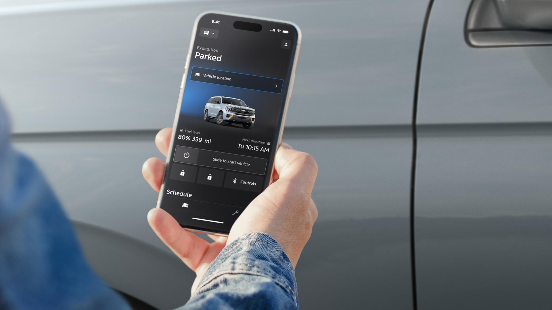 Person using the available remote features on the Ford app to access a 2027 Ford Expedition® SUV