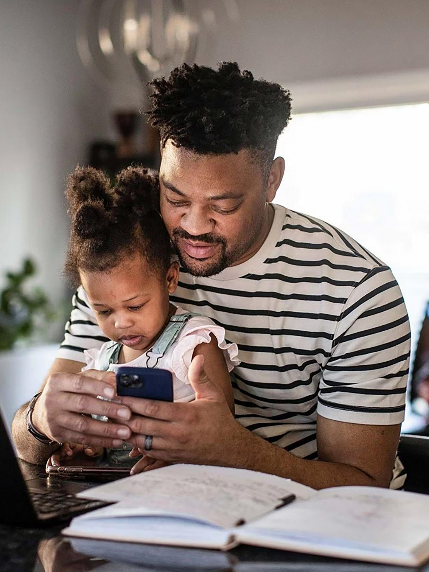 Family looking at a mobile phone