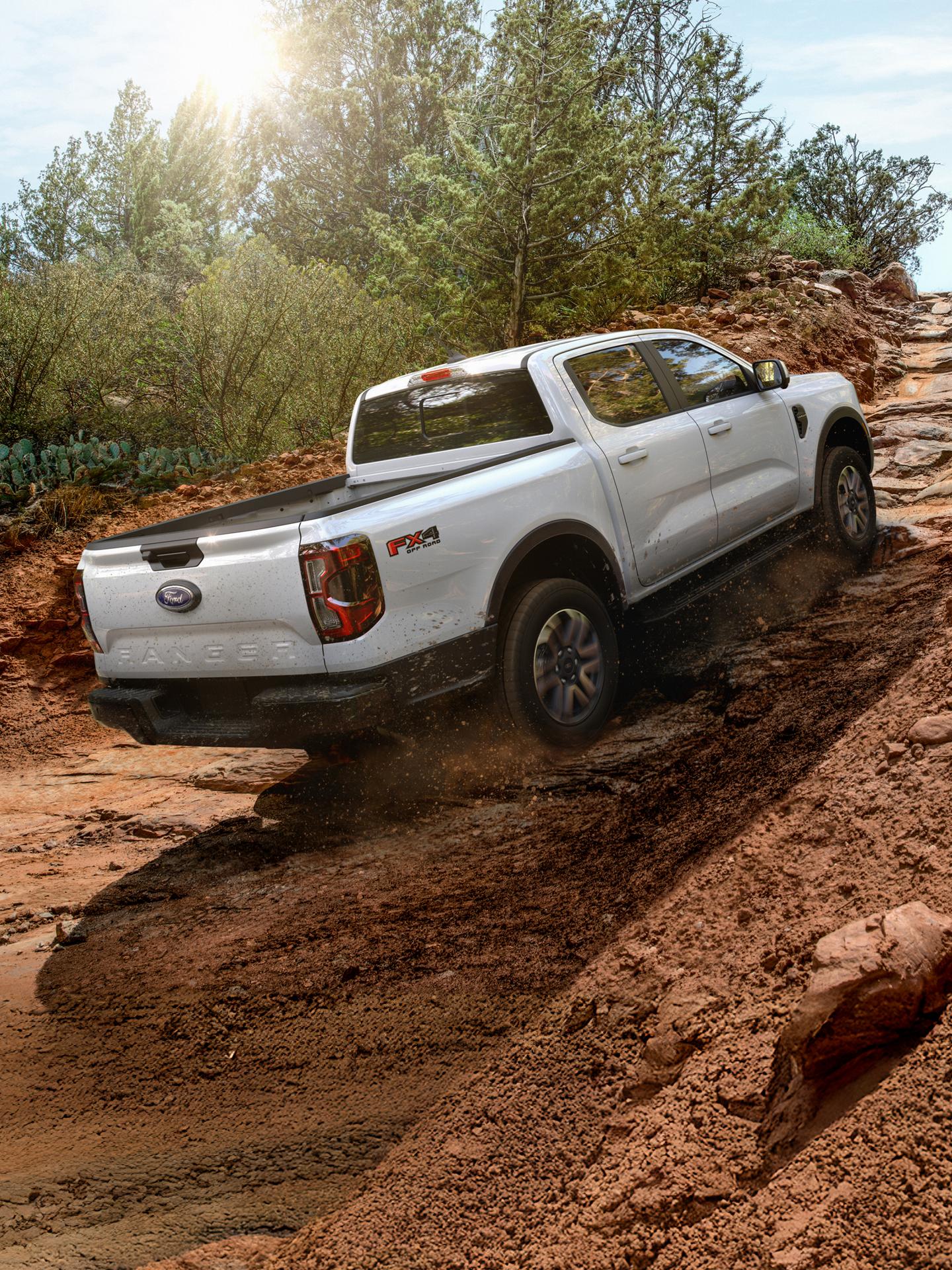 2026 Ford Ranger® Lariat® model with the FX4® Off-Road Package driving up a steep hill