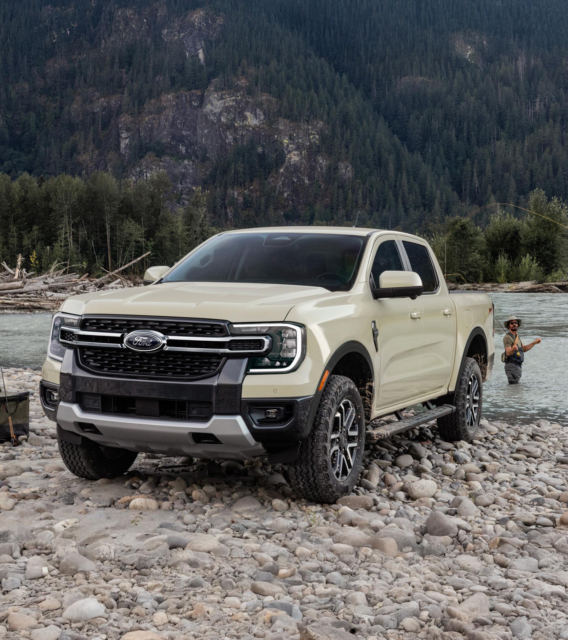 Two people fishing in a lake next to their 2026 Ford Ranger® truck