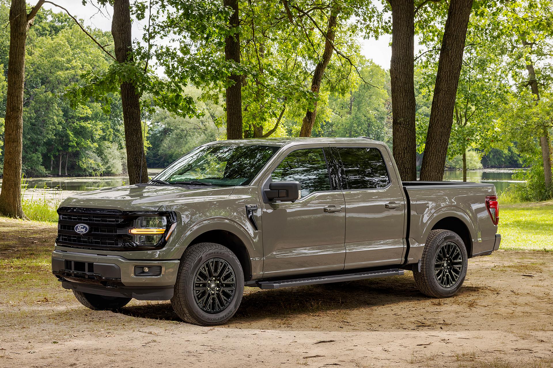 A 2027 Ford F-150® XLT pickup parked in a wooded area