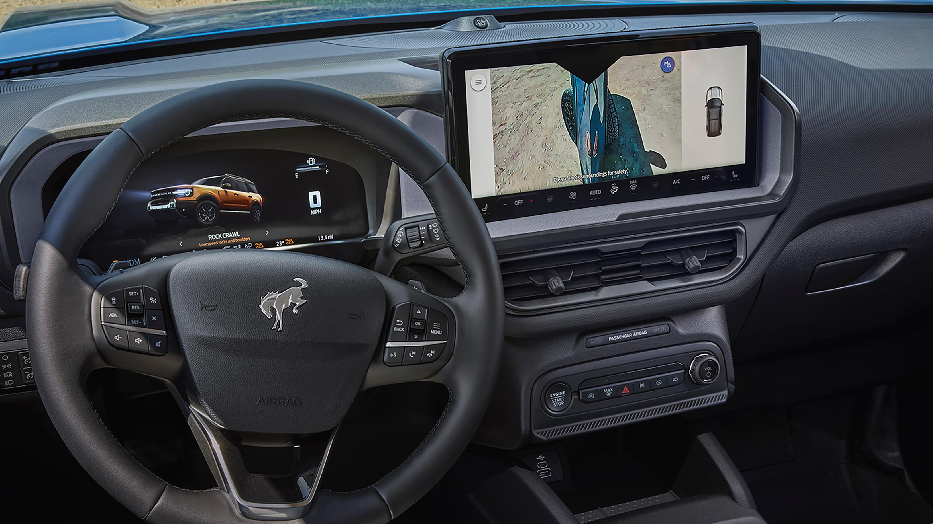 Inside a 2026 Ford Bronco Sport® with a view of the rearview camera inside the camera lens