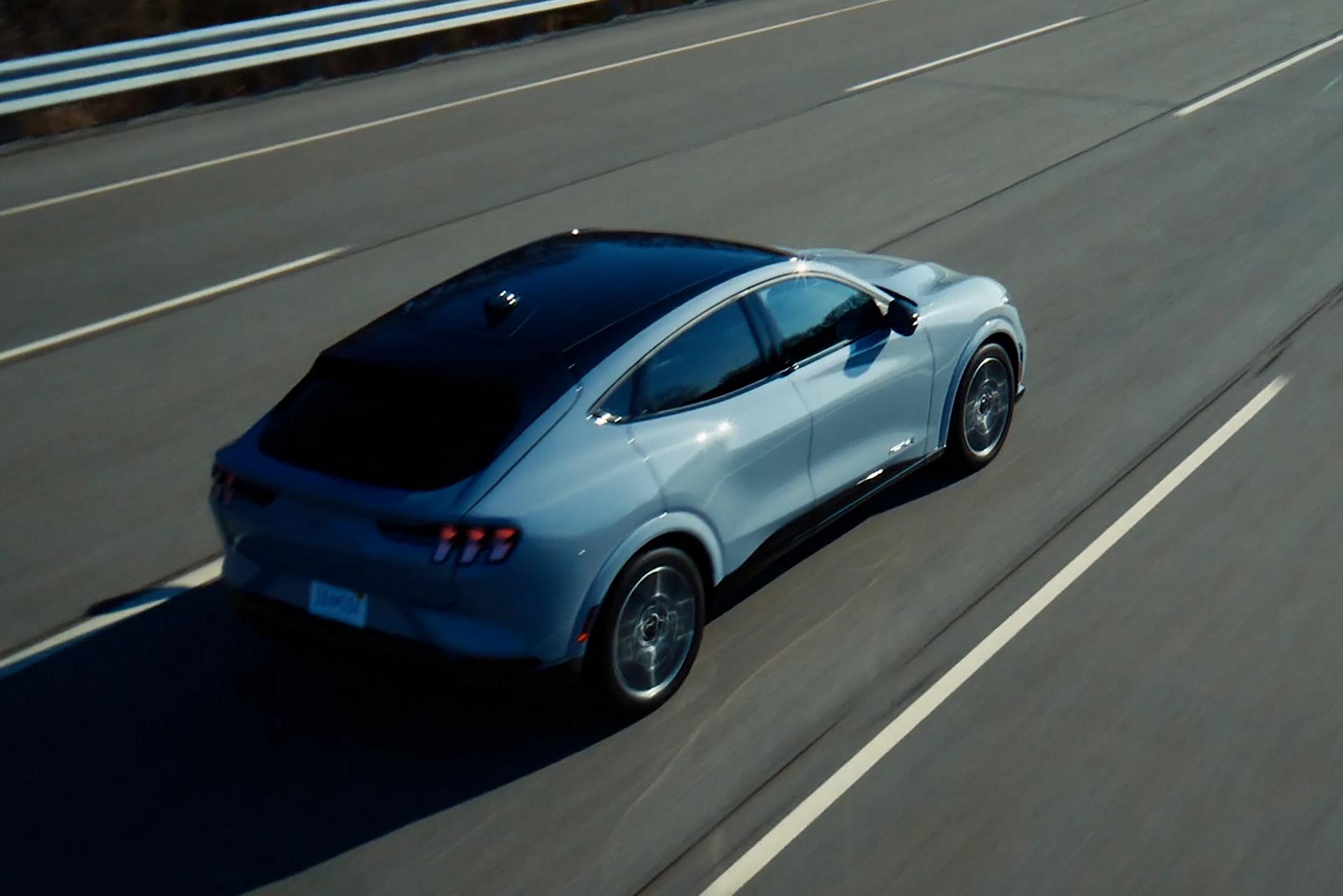 Overhead view of a 2025 Mustang Mach-E® GT model being driven on a five-lane highway
