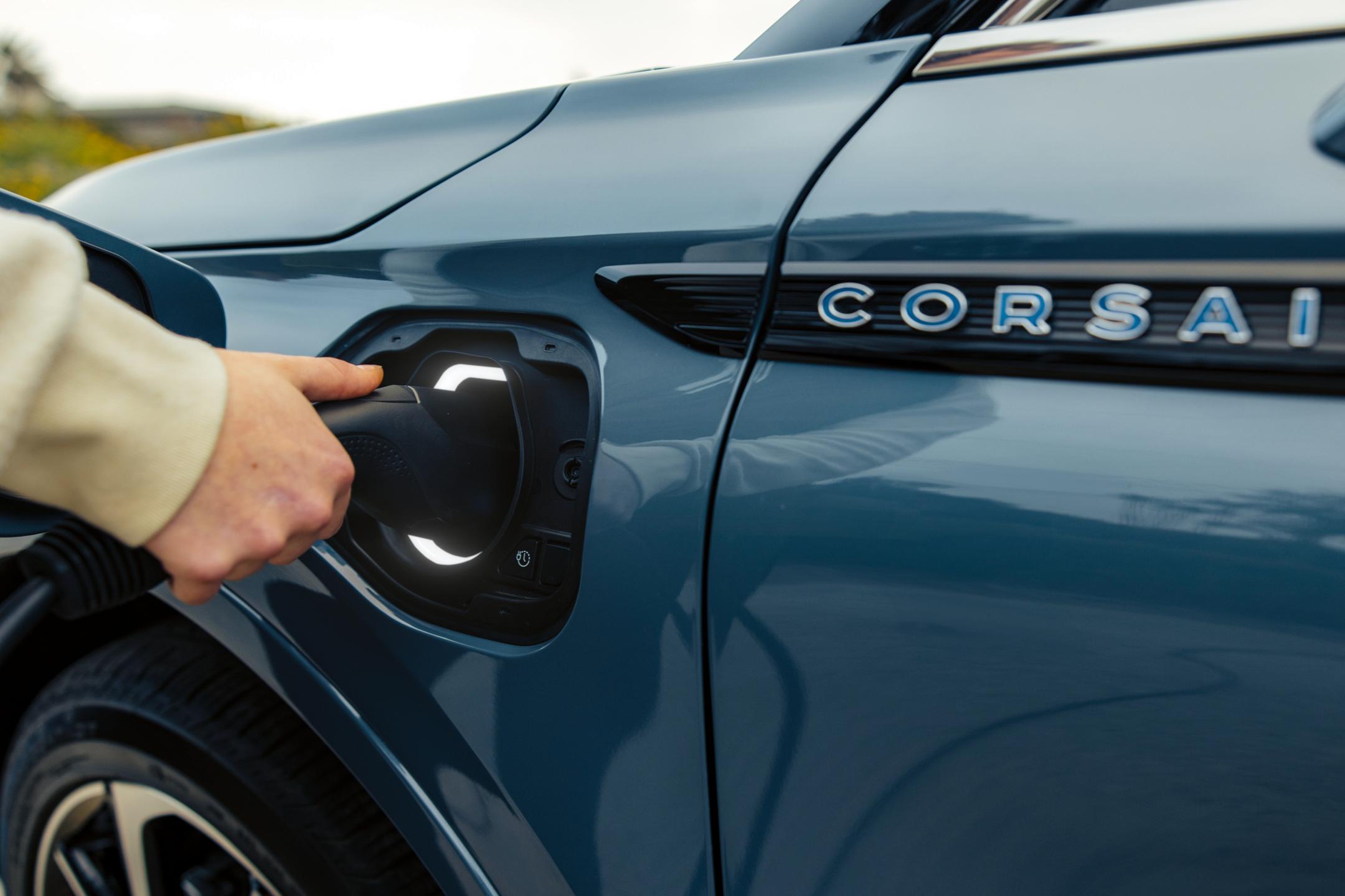 A person plugs the Lincoln Mobile Power Cord into the charging port of a 2024 Lincoln Corsair® SUV