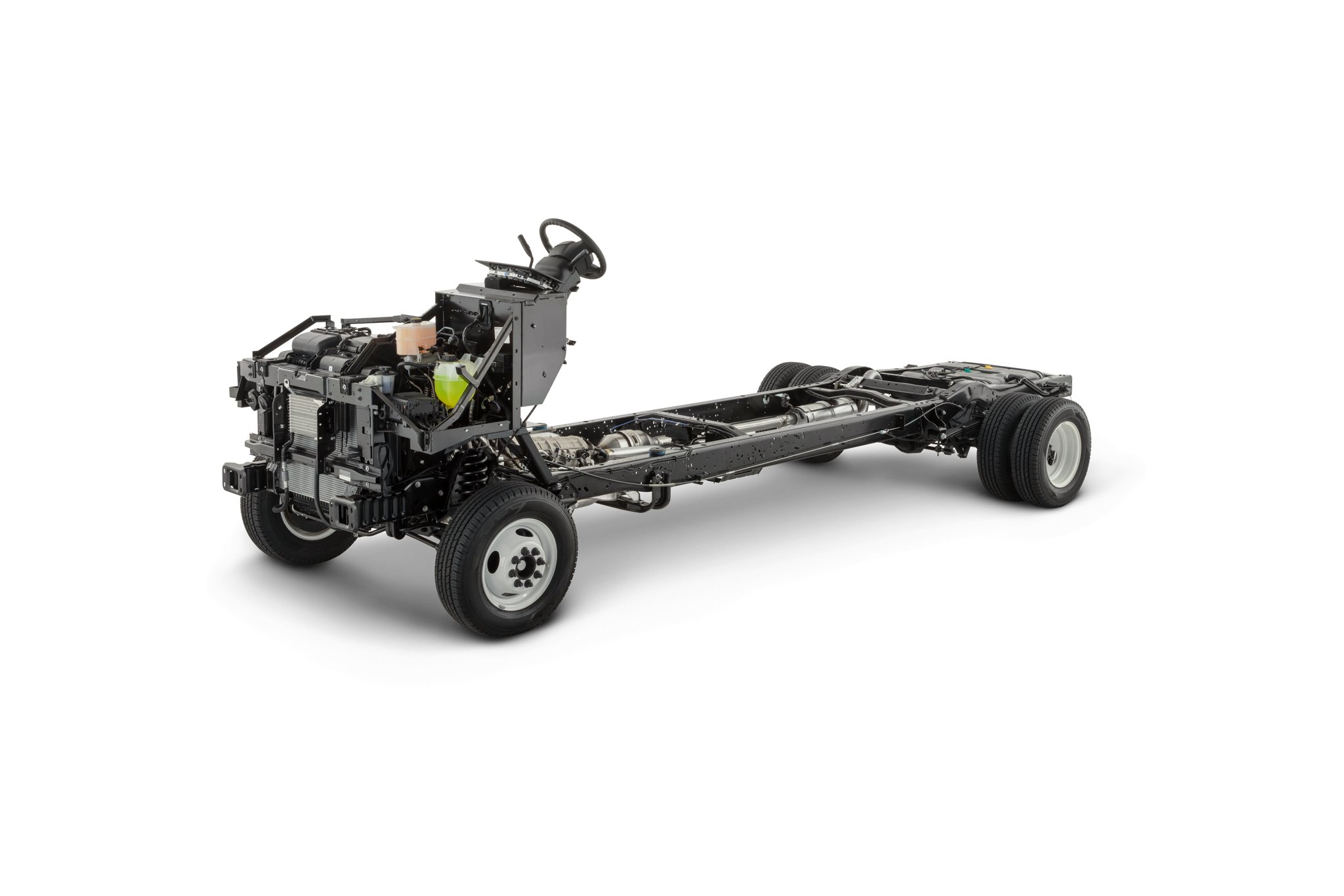 Vue latérale d’un châssis nu Ford série E 2025 sans carrosserie sur fond blanc