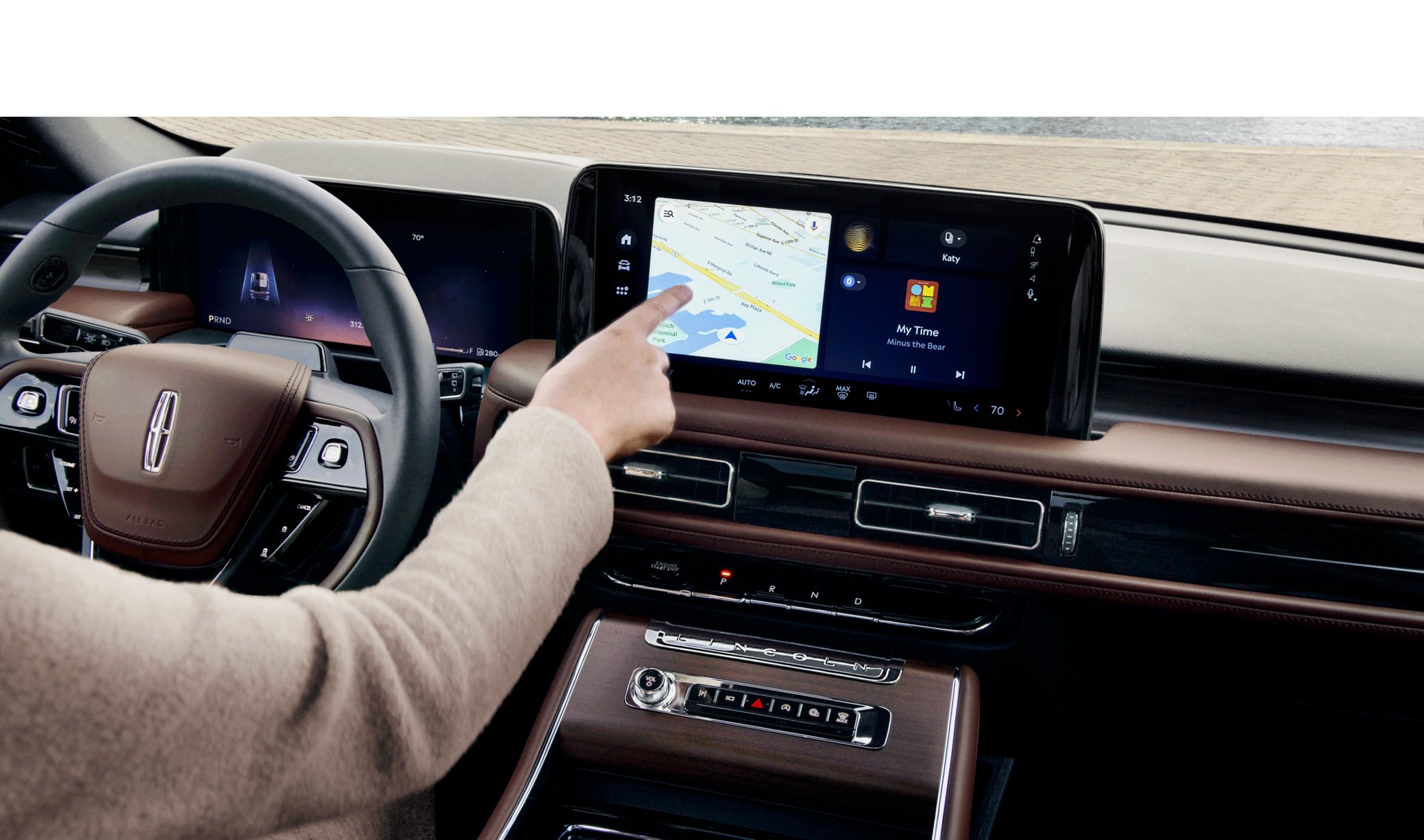 A man touching the center touch screen.