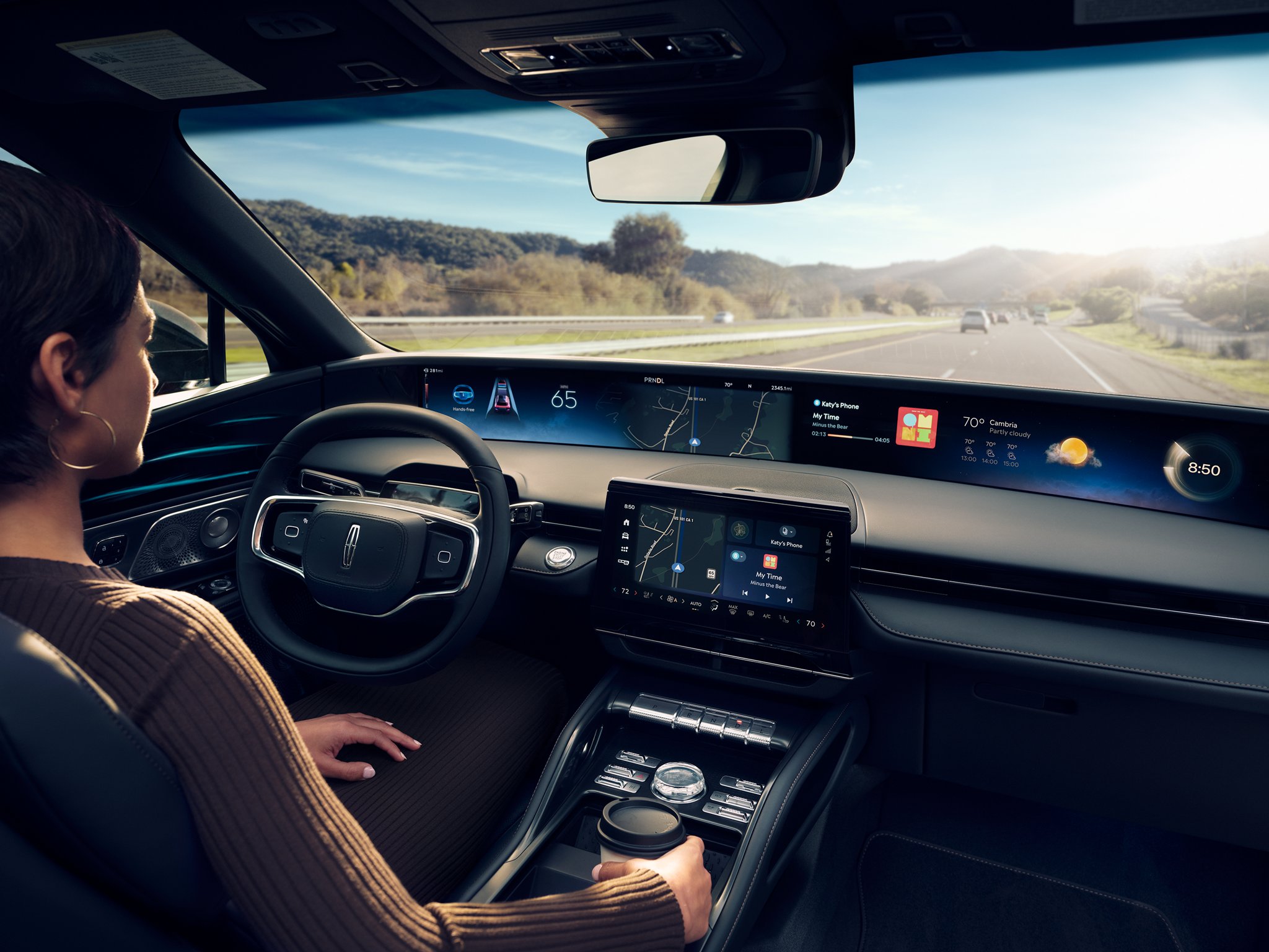 A woman is shown in the driver’s seat of a Lincoln Nautilus® SUV.