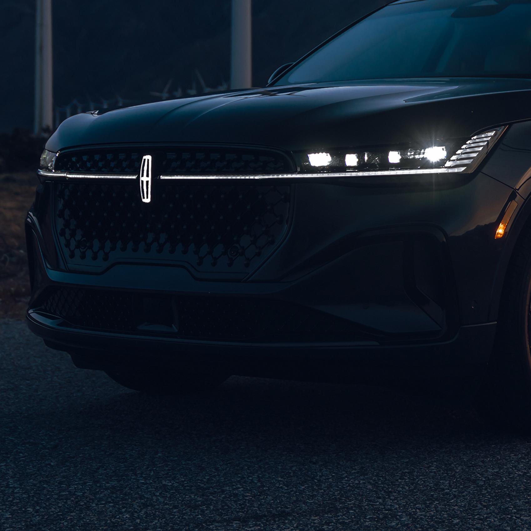 An LED light bar and illuminated Lincoln Star logo grace the grille of a 2026 Lincoln Nautilus® SUV