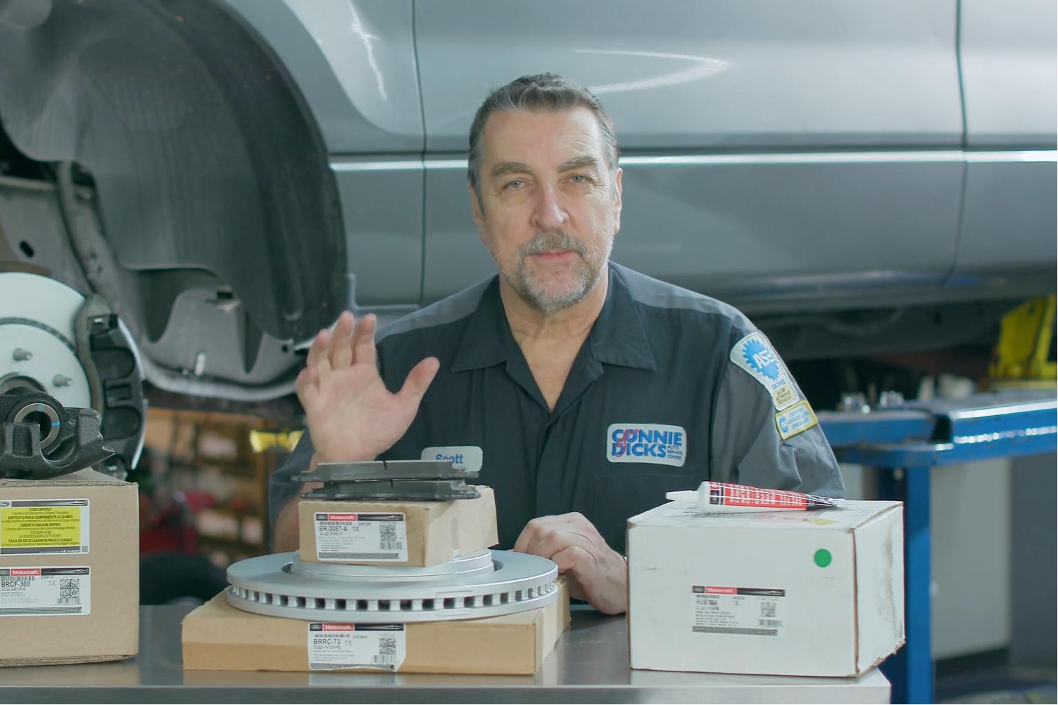 A Ford Service technician with Motorcraft parts