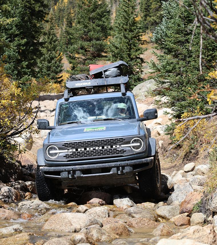 A 2025 Ford Bronco® SUV driving on a rocky trail