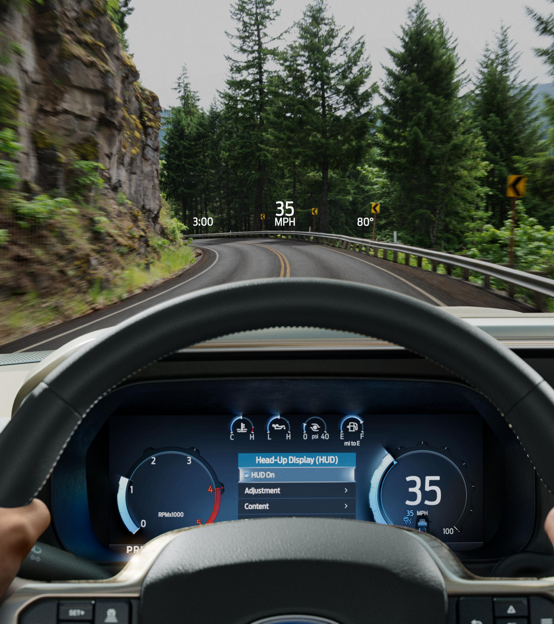 A person driving their 2026 Ford Super Duty® truck from their point of view, while using the head-up display feature