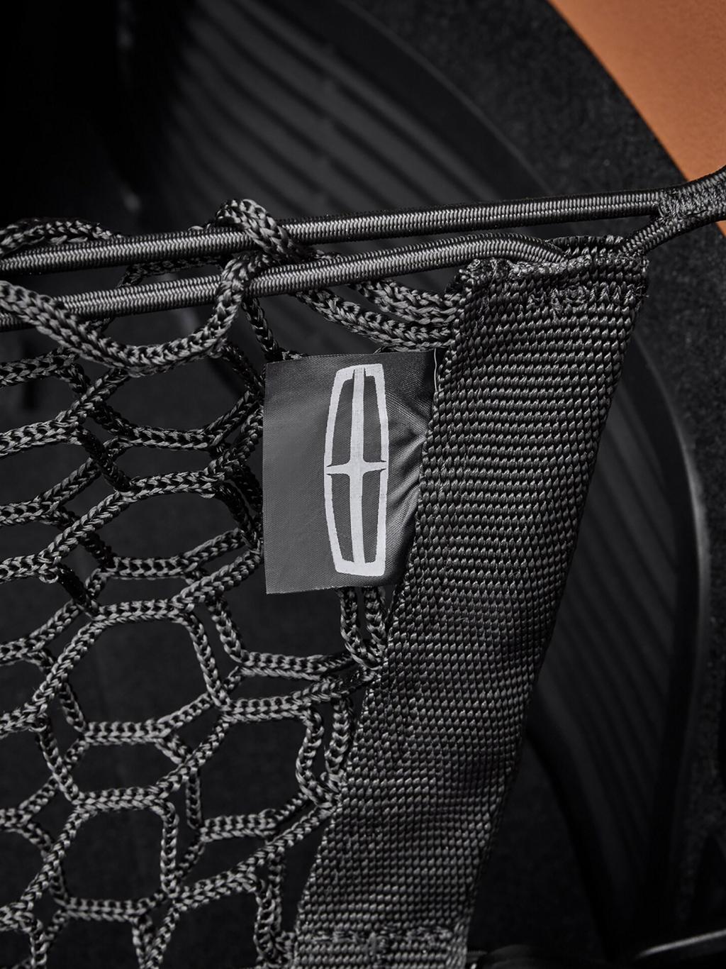 Close-up of a Lincoln logo cargo net