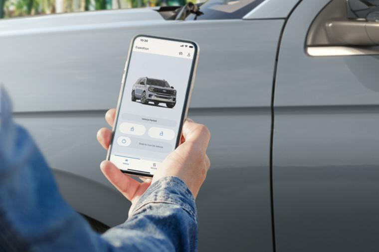 Person using the available Phone As A Key feature on the Ford app to access a 2026 Ford Expedition® SUV