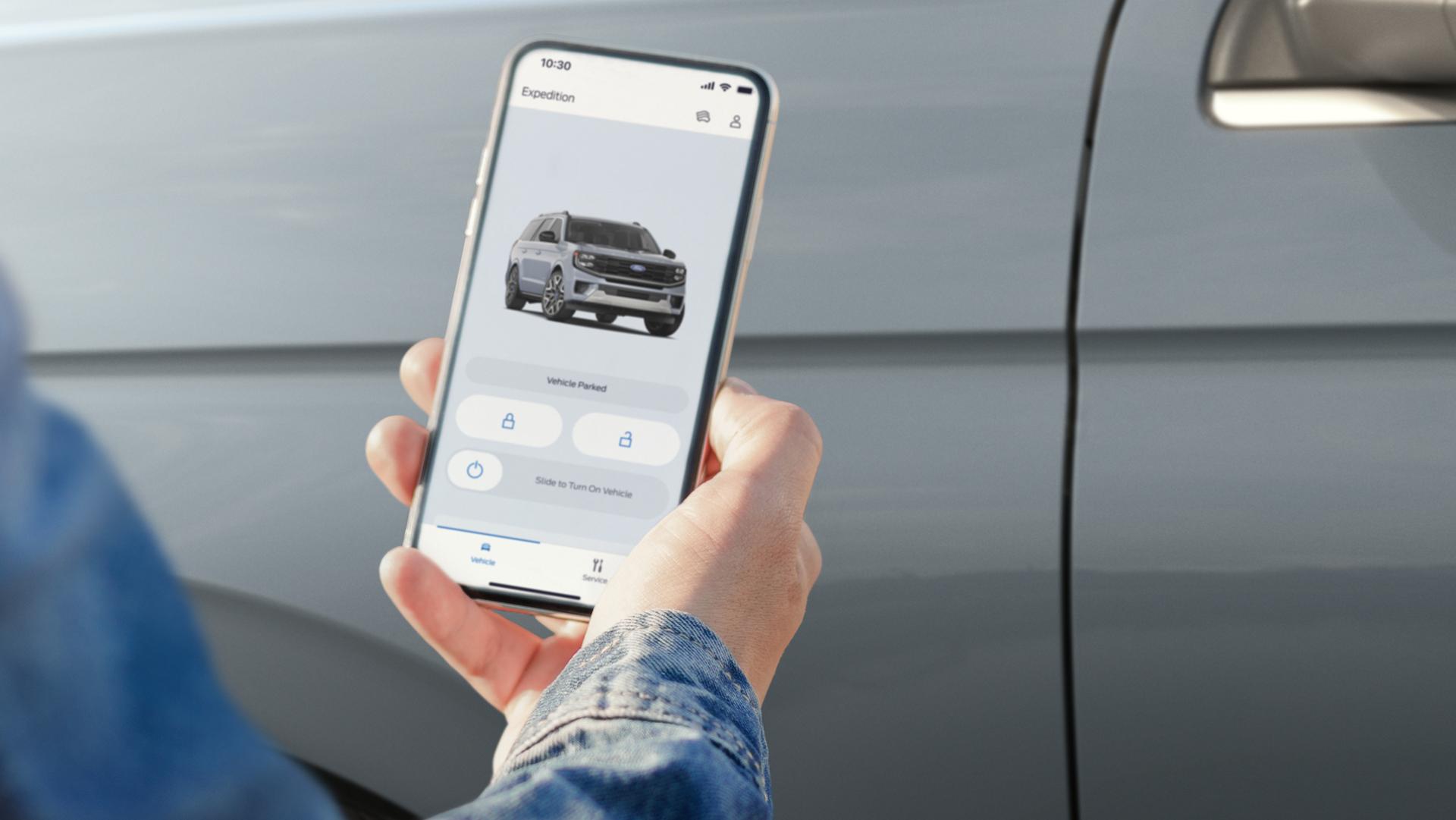 Person using the available Phone As A Key feature on the Ford app to access a 2026 Ford Expedition® SUV