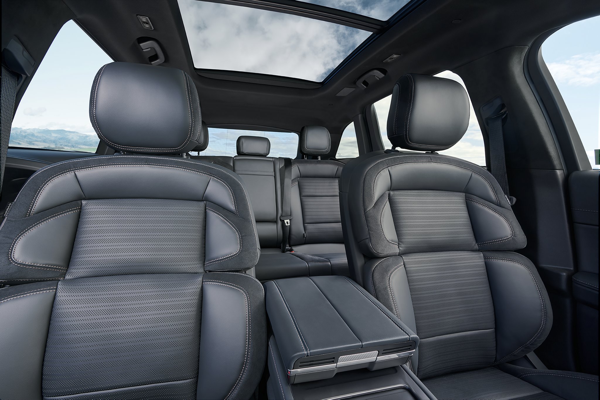 A spacious interior view of a 2025 Lincoln Nautilus SUV from the front row to the second row