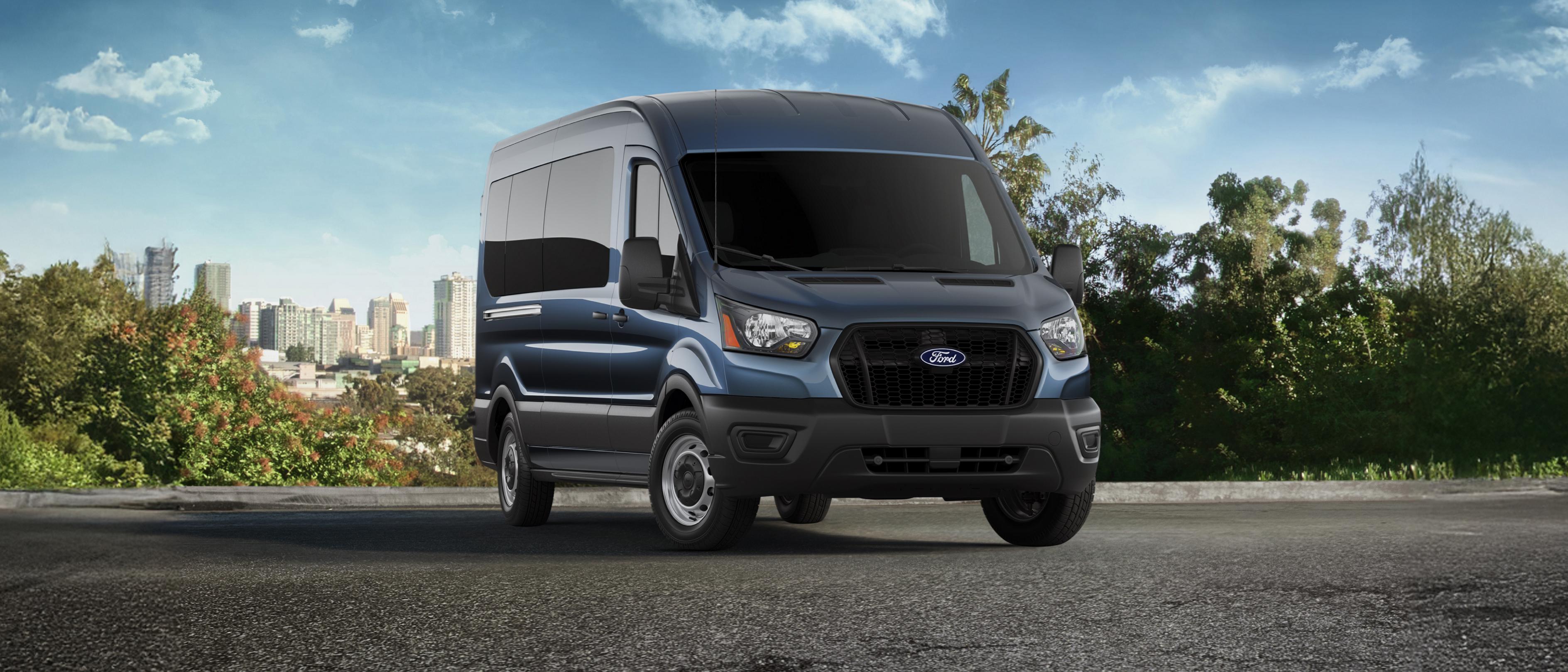 Blue 2026 Ford Transit® van parked overlooking a city horizon