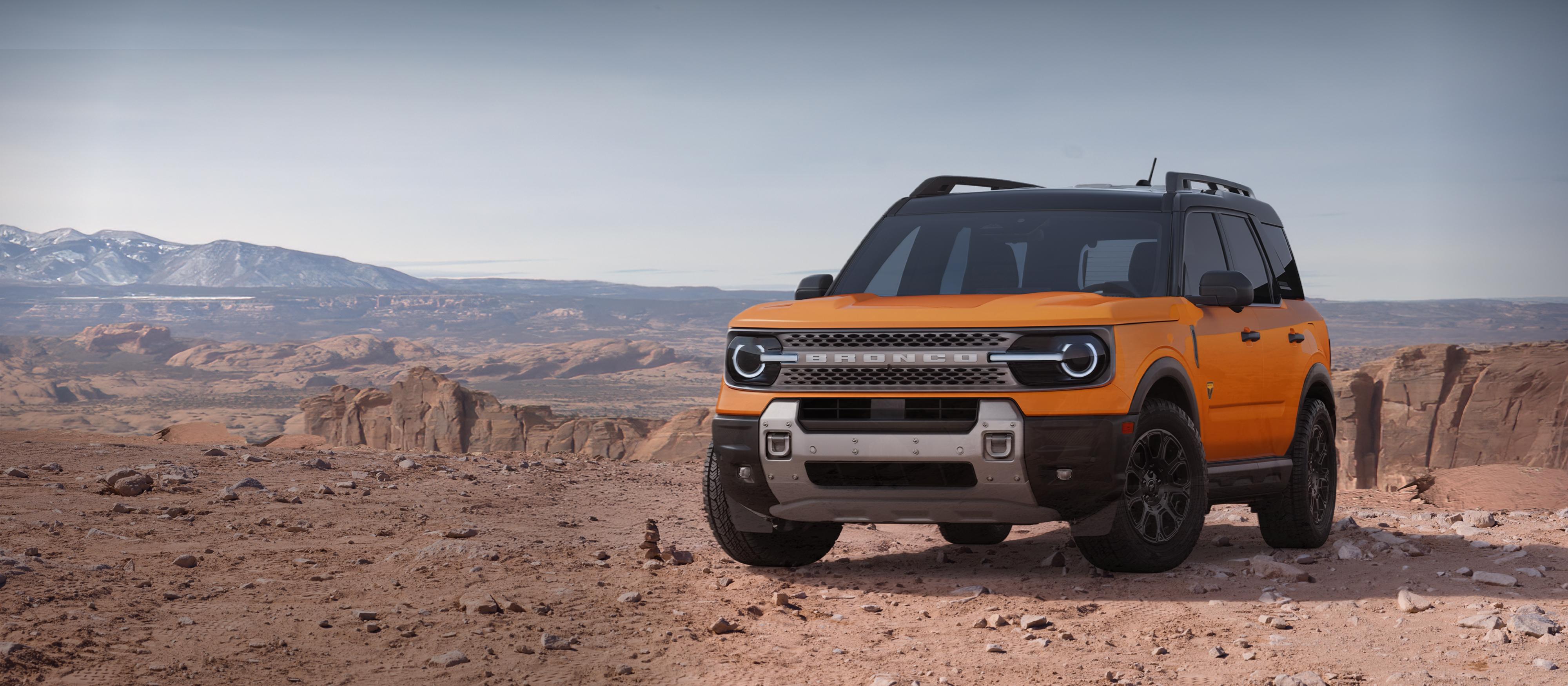 2026 Ford Bronco Sport® Badlands® SUV parked on dirt with rocky cliffs in background