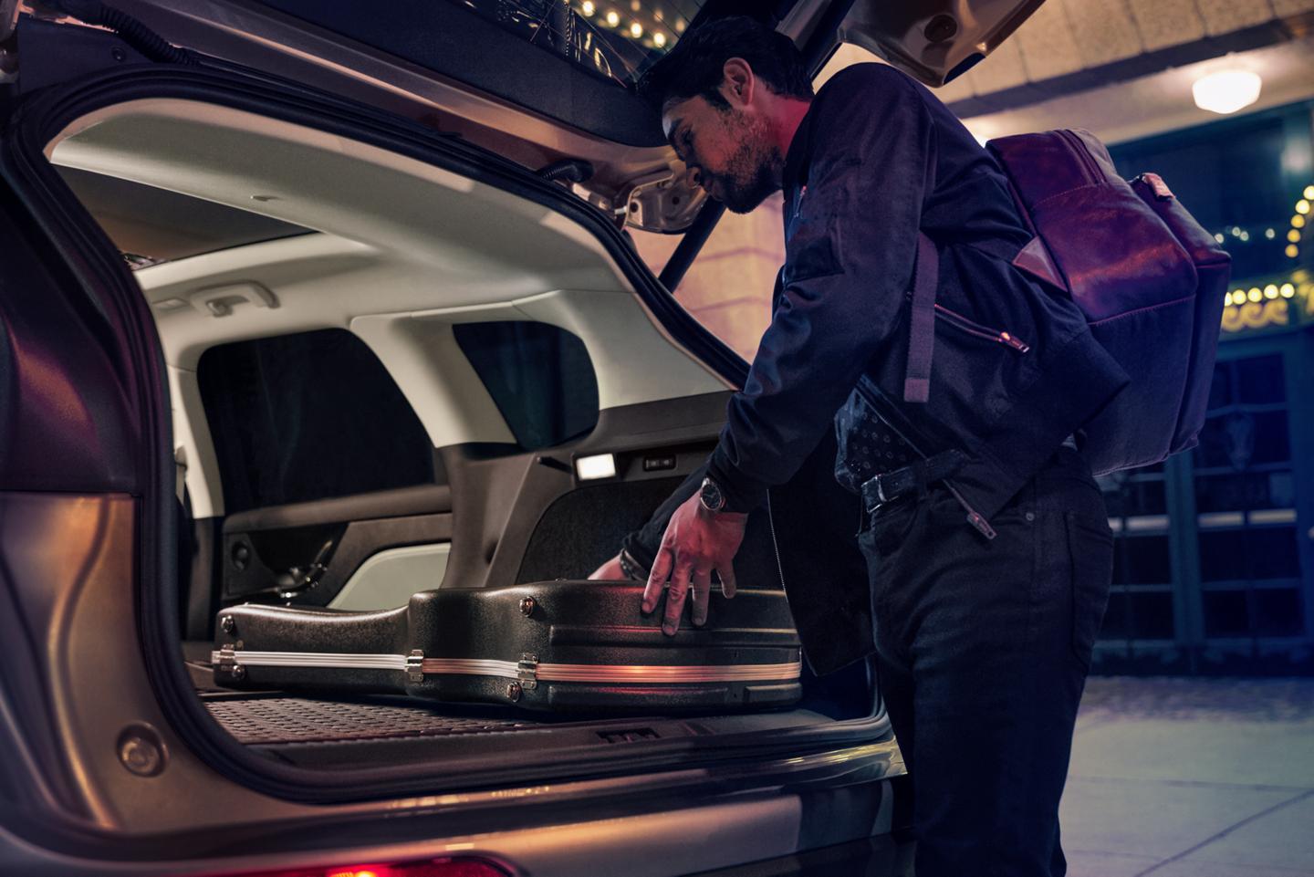 A person loads music equipment into the rear cargo area of a 2026 Lincoln Corsair® SUV