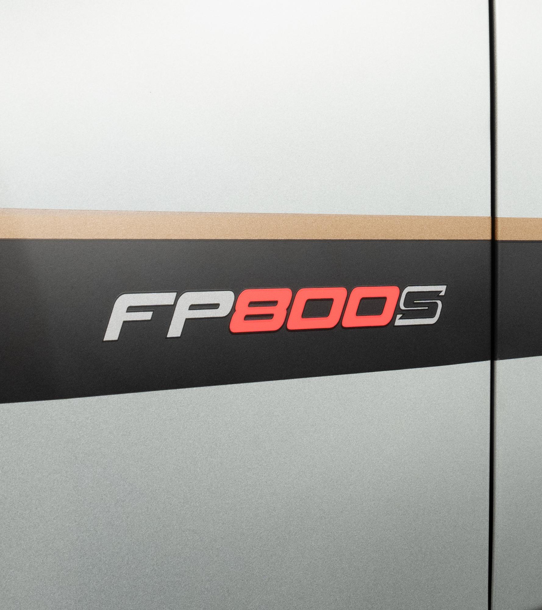 Bodyside detail of the black FP800S graphic with red lettering and a bronze pinstripe on a gray Mustang door