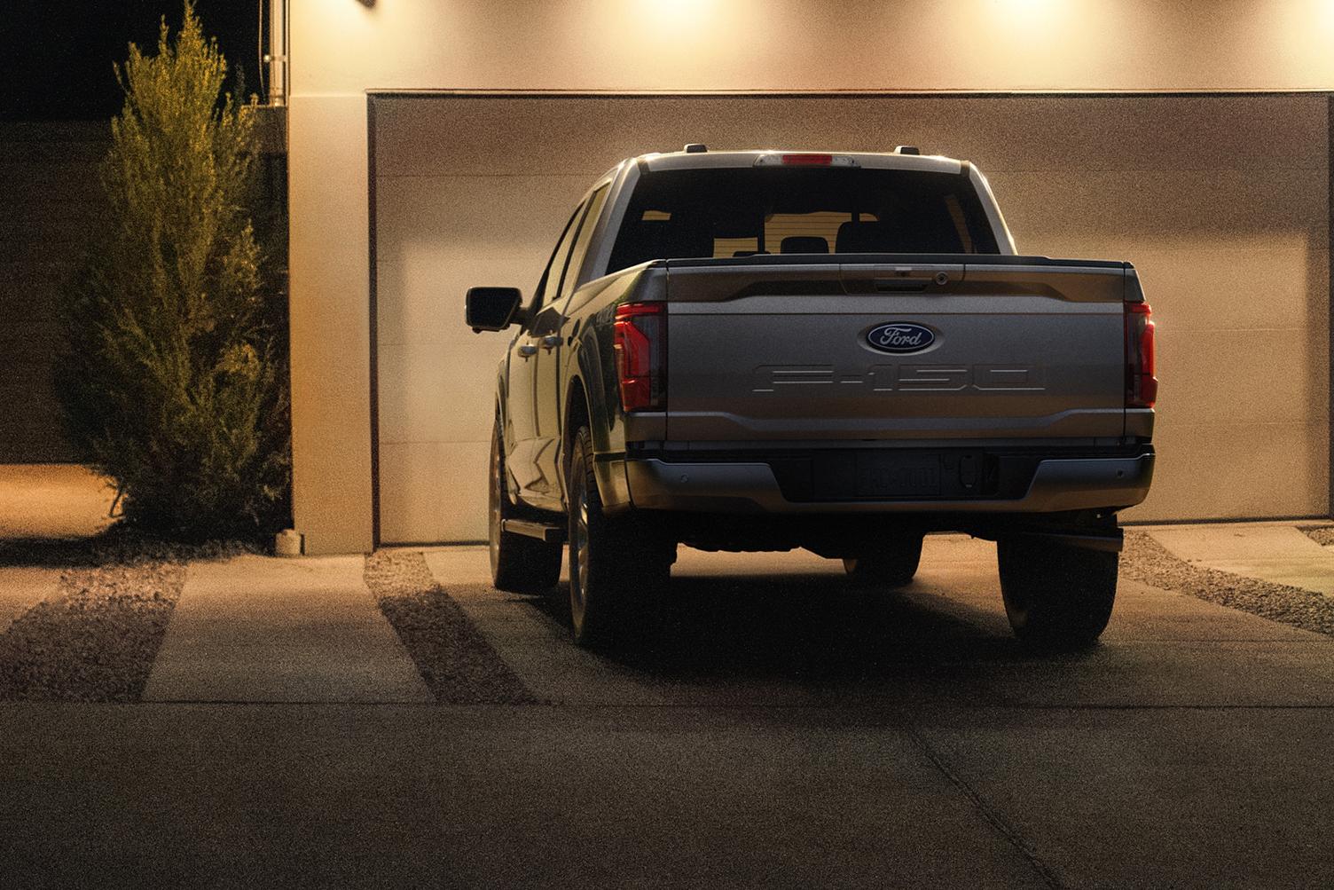 Ford F‑150® parked in a driveway at night