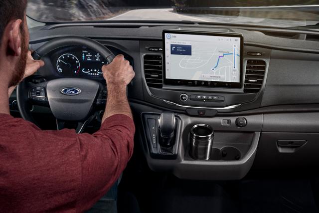 Person driving a 2025 Ford Transit® model with available SYNC® 4 and 12-inch multi-function display