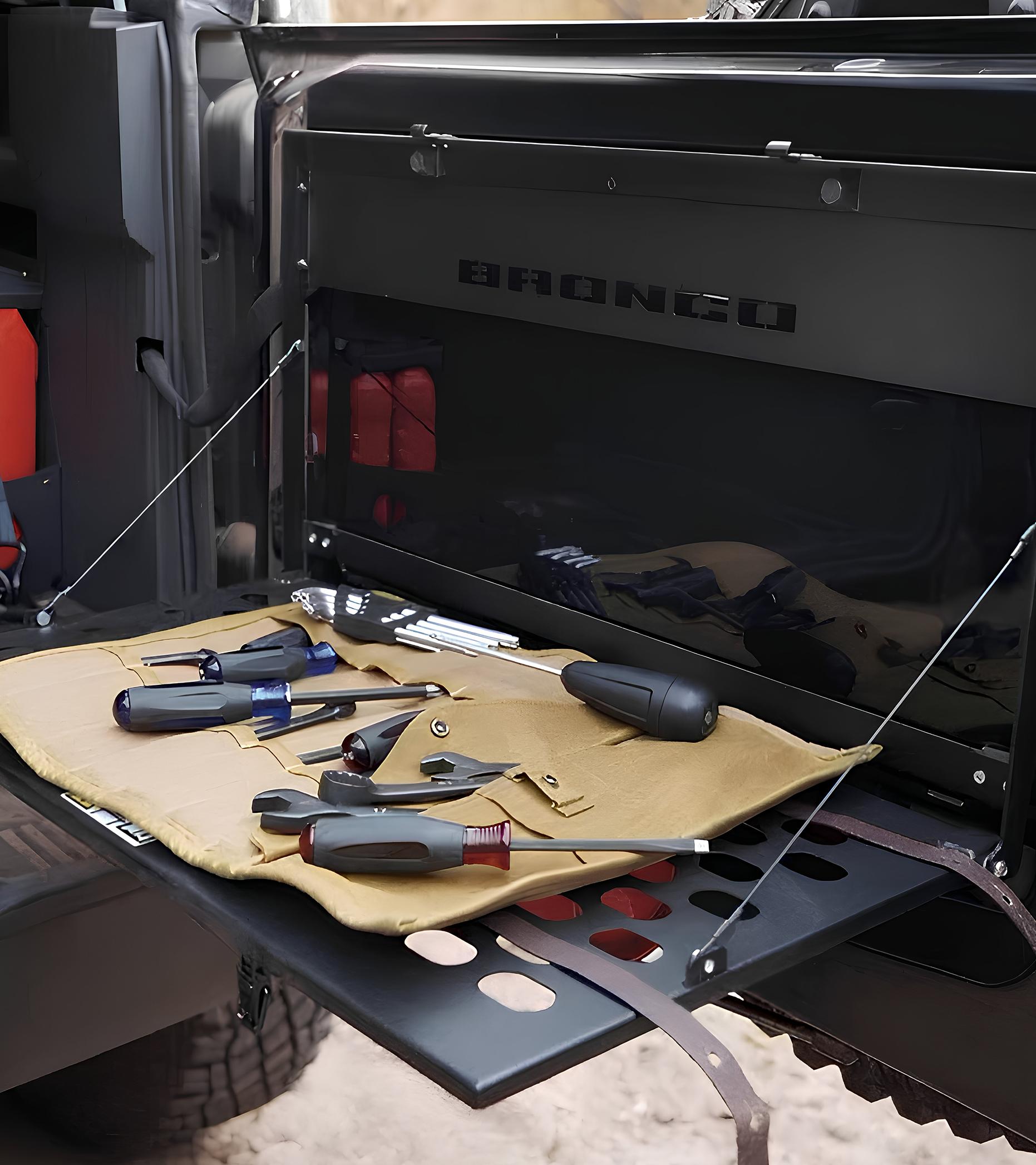 Roll-up tool set opened and displayed on a Ford Bronco® SUV cargo shelf