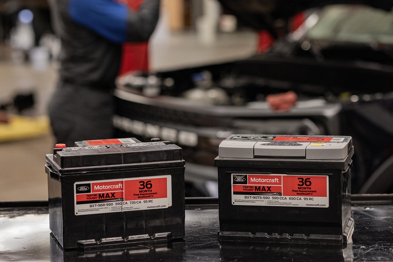 Two Motorcraft® batteries on a work bench