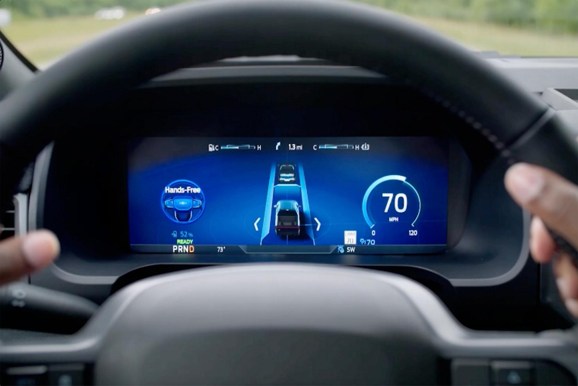 The BlueCruise screen shown behind a steering wheel