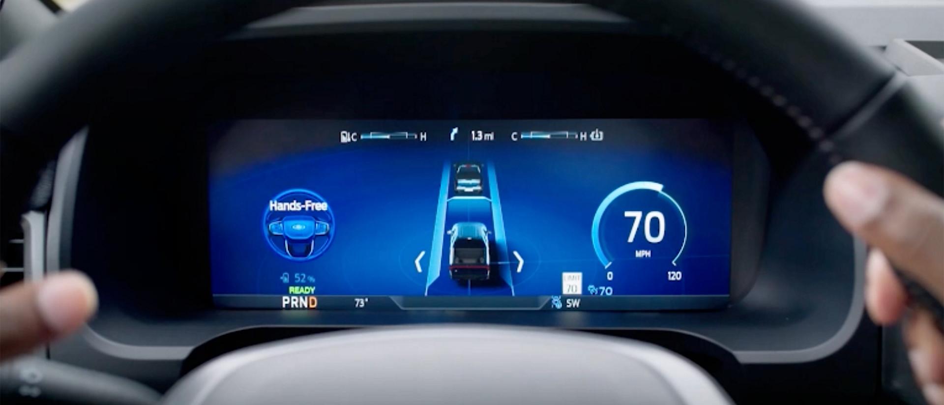 The BlueCruise screen shown behind a steering wheel