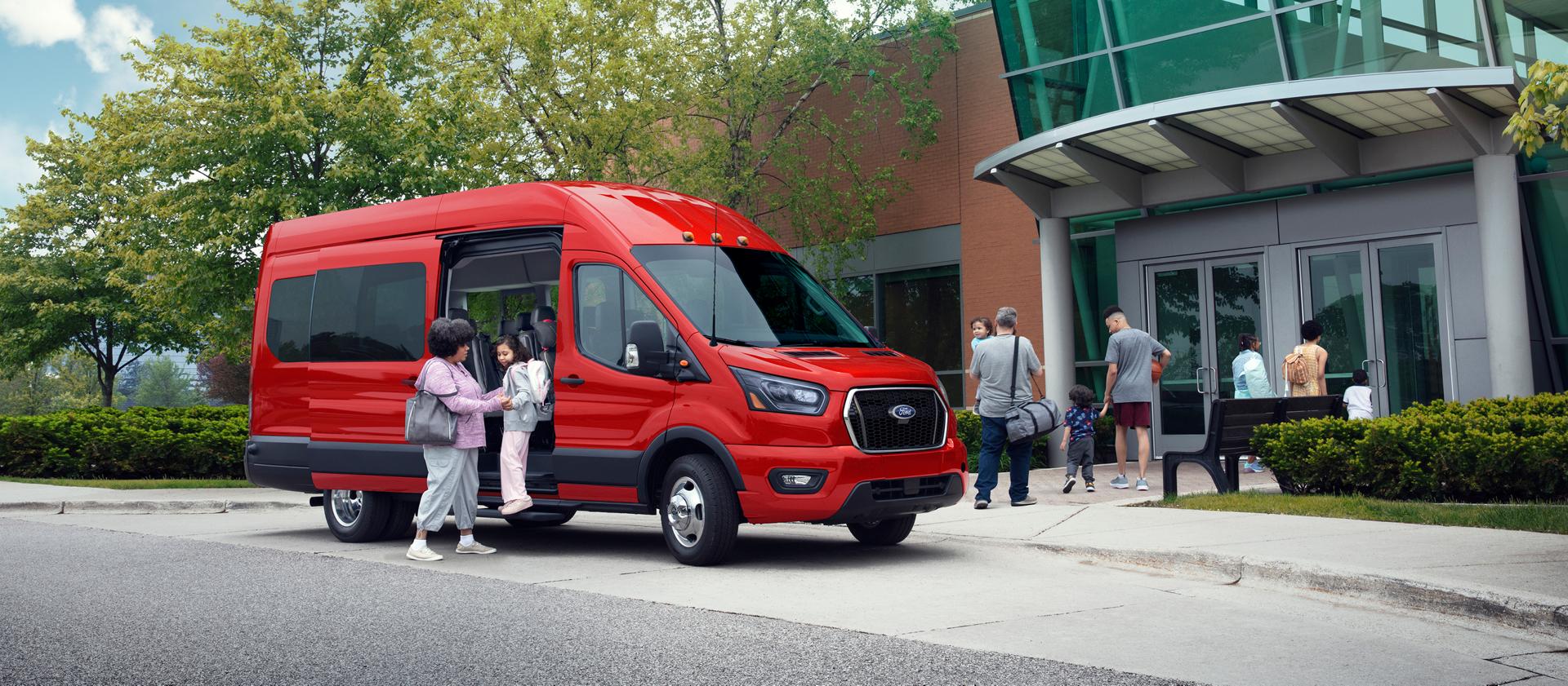 A group of people departing a 2026 Ford Transit® van