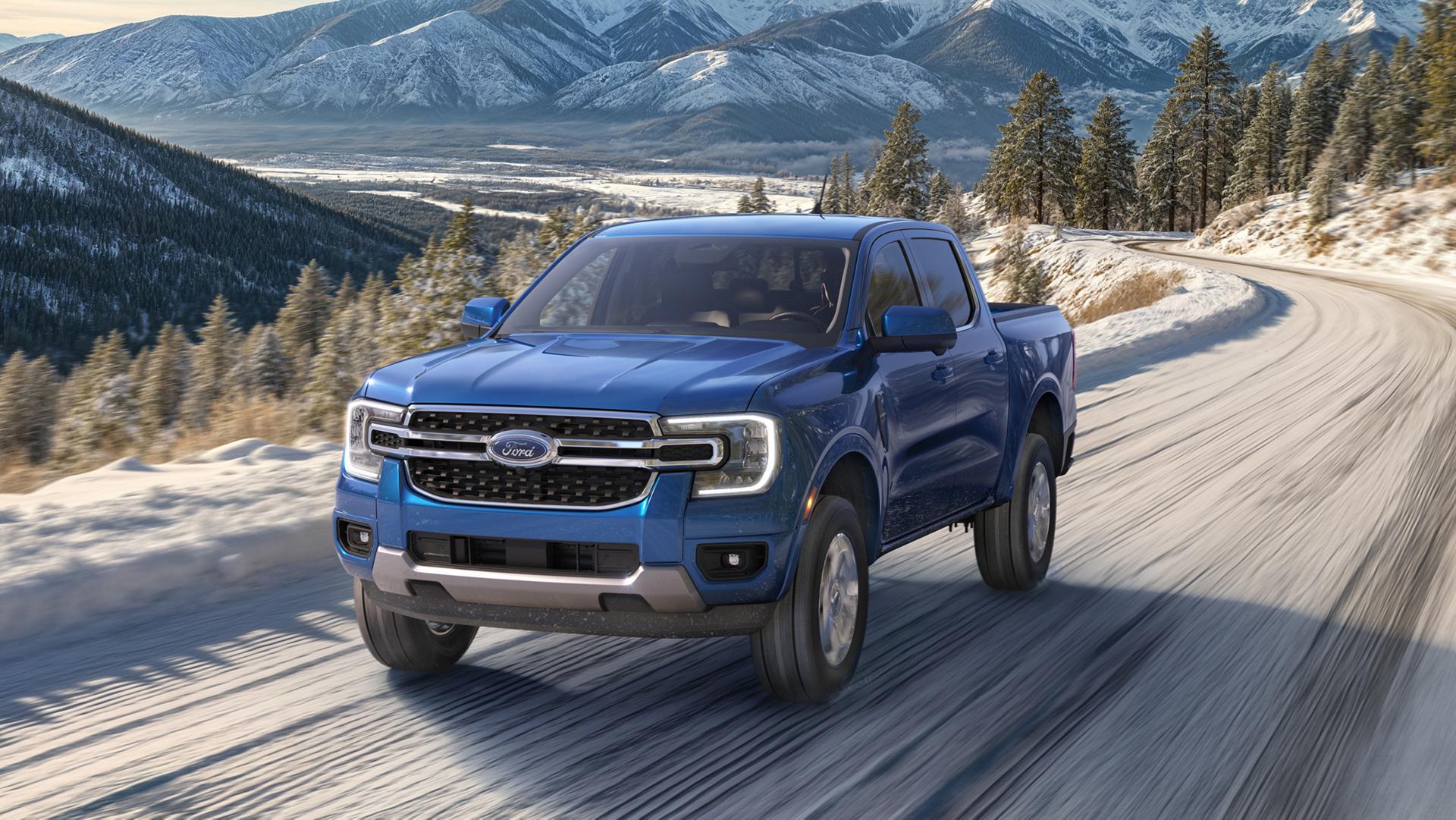 A 2026 Ford Ranger® Lariat® model with the Chrome Accent Package being driven on a snowy road