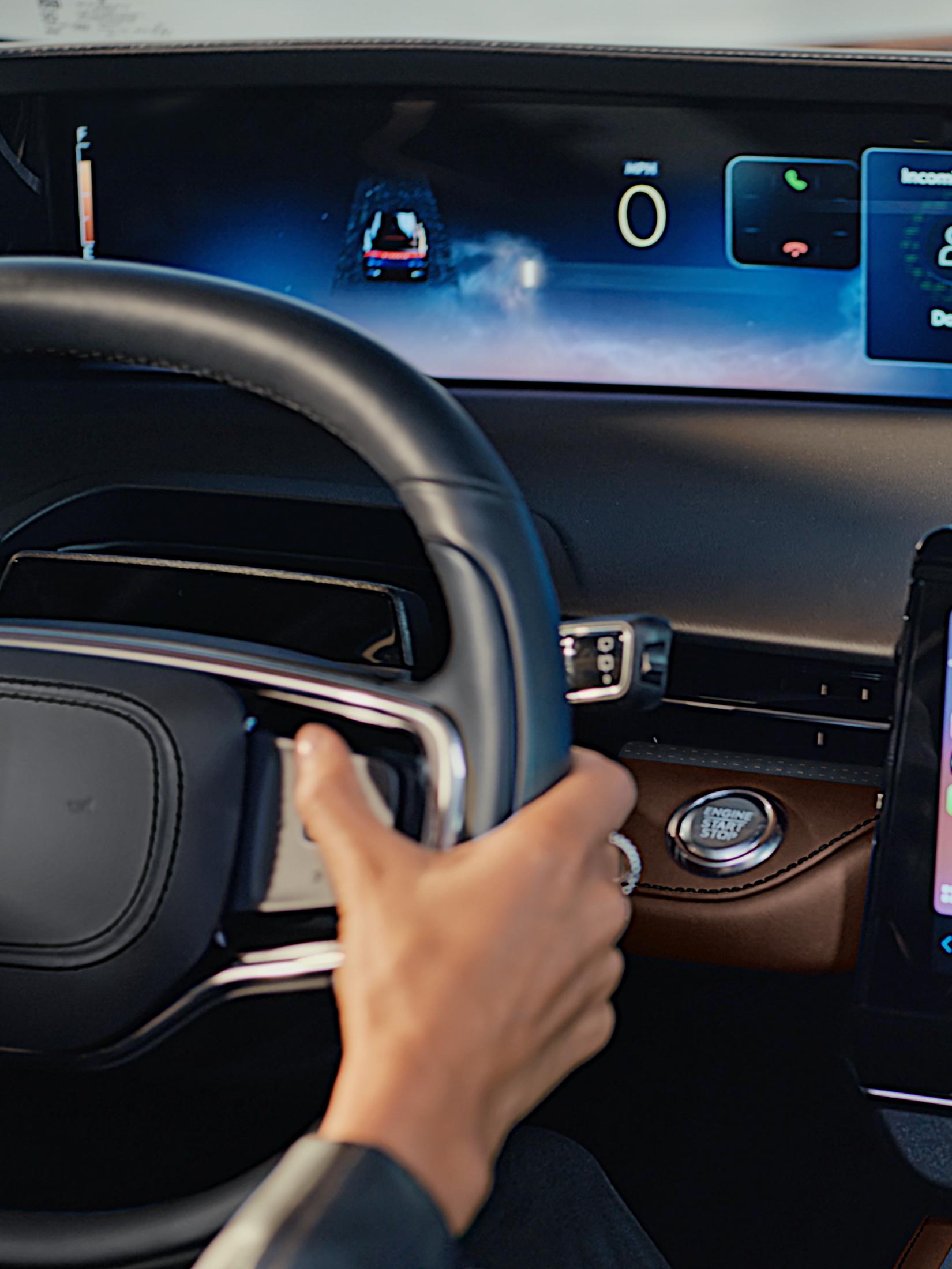 The driver of a 2026 Lincoln Nautilus® SUV uses the Advanced steering wheel controls