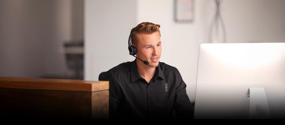 A customer service representative is seen working