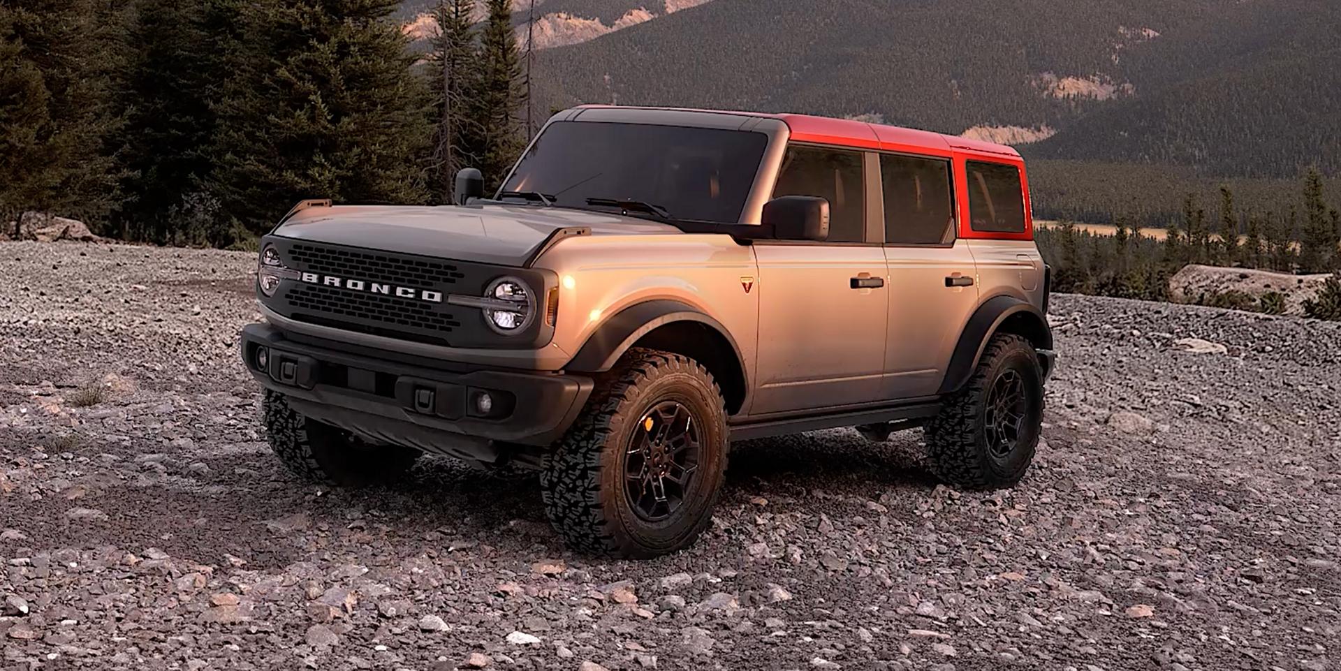 A 2026 Ford Bronco® SUV parked on a grassy hillside in the mountains