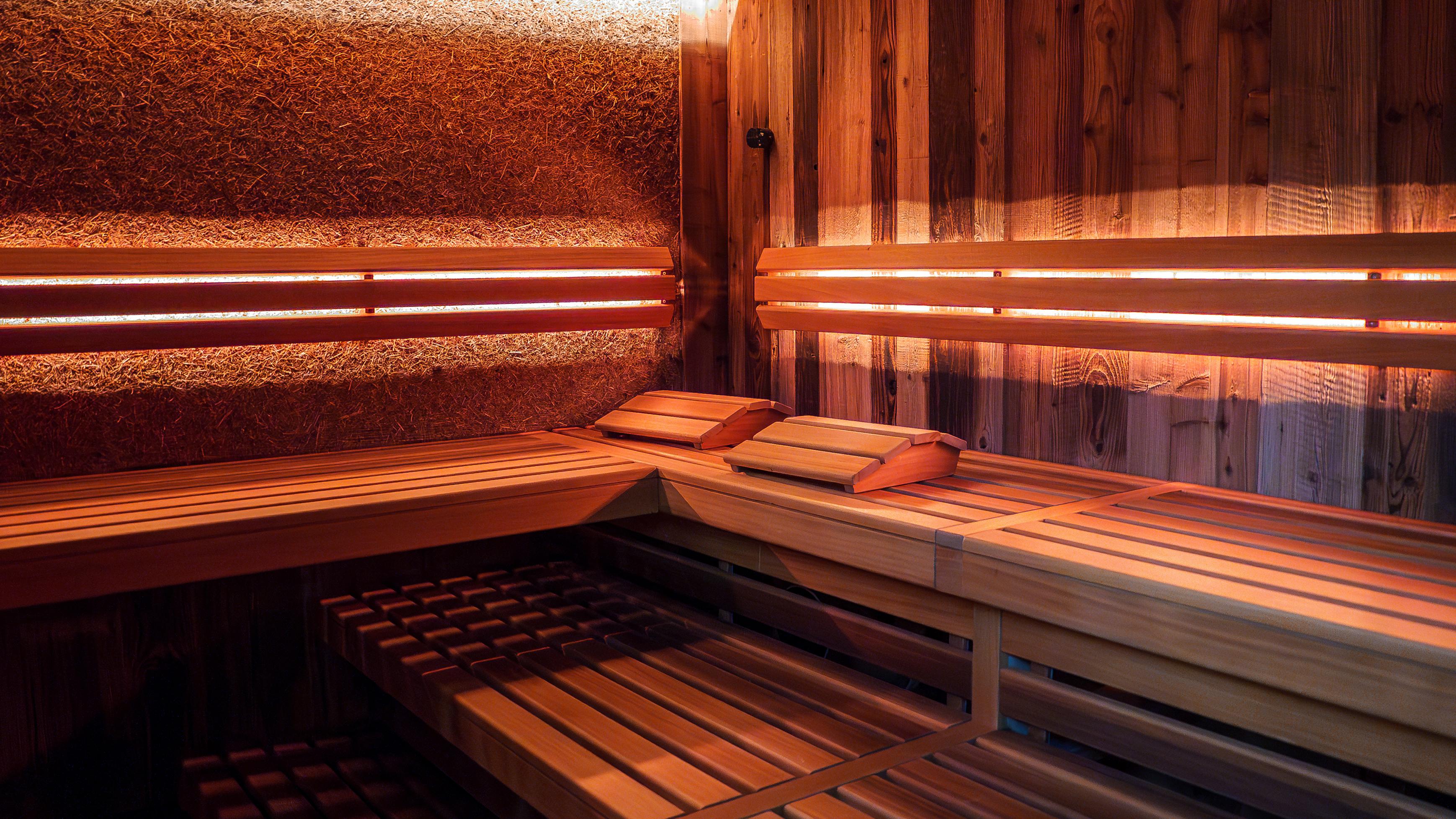 A warmly lit interior of a sauna