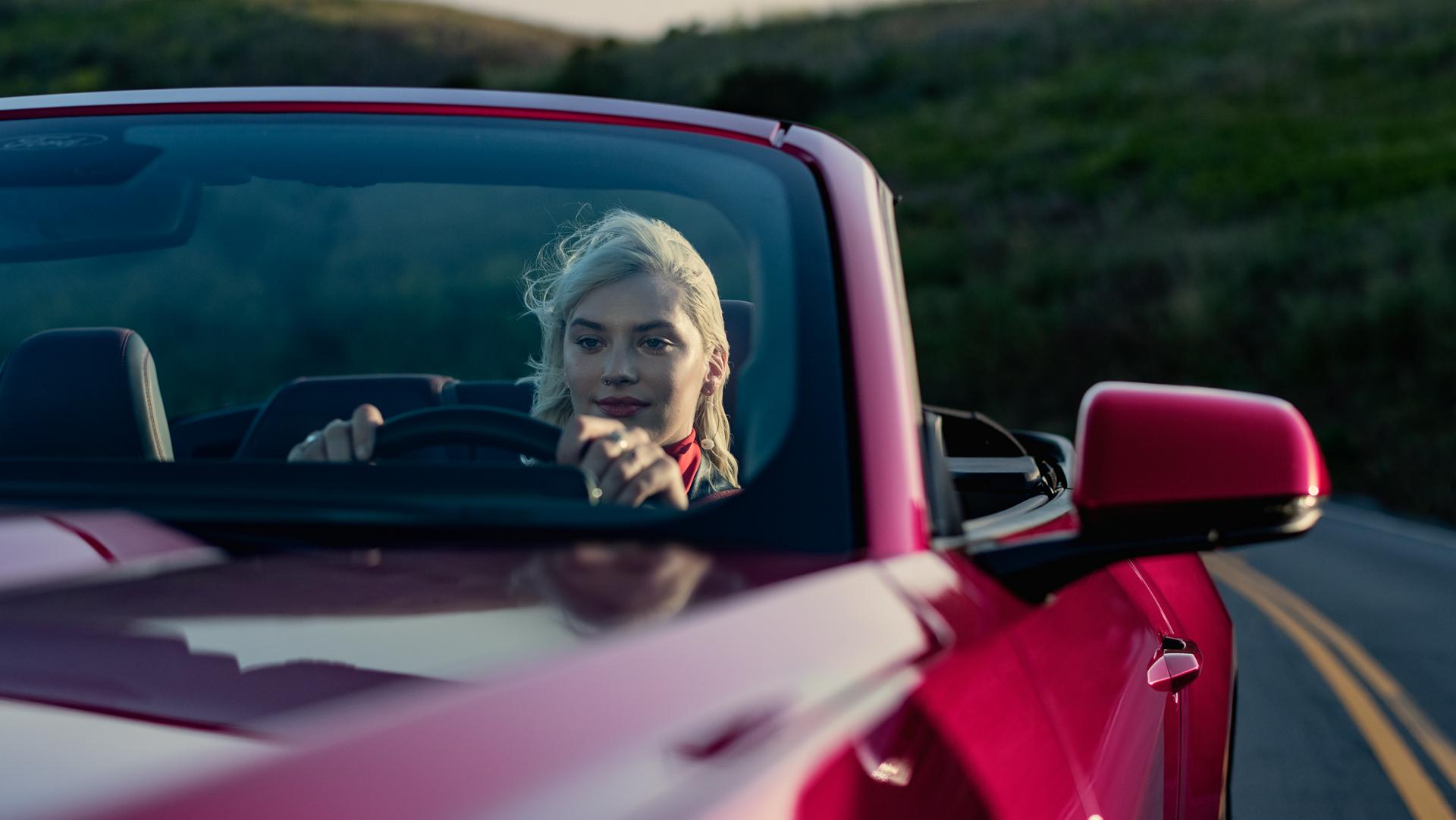 Person driving a 2026 Ford Mustang® GT convertible on a highway