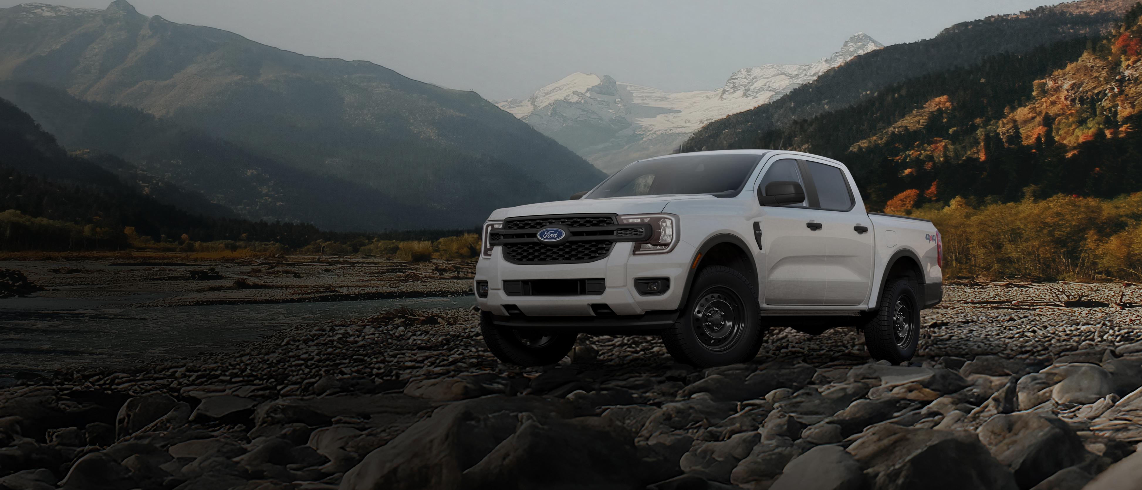A 2026 Ford Ranger® XL model parked on a rocky river bank in the mountains