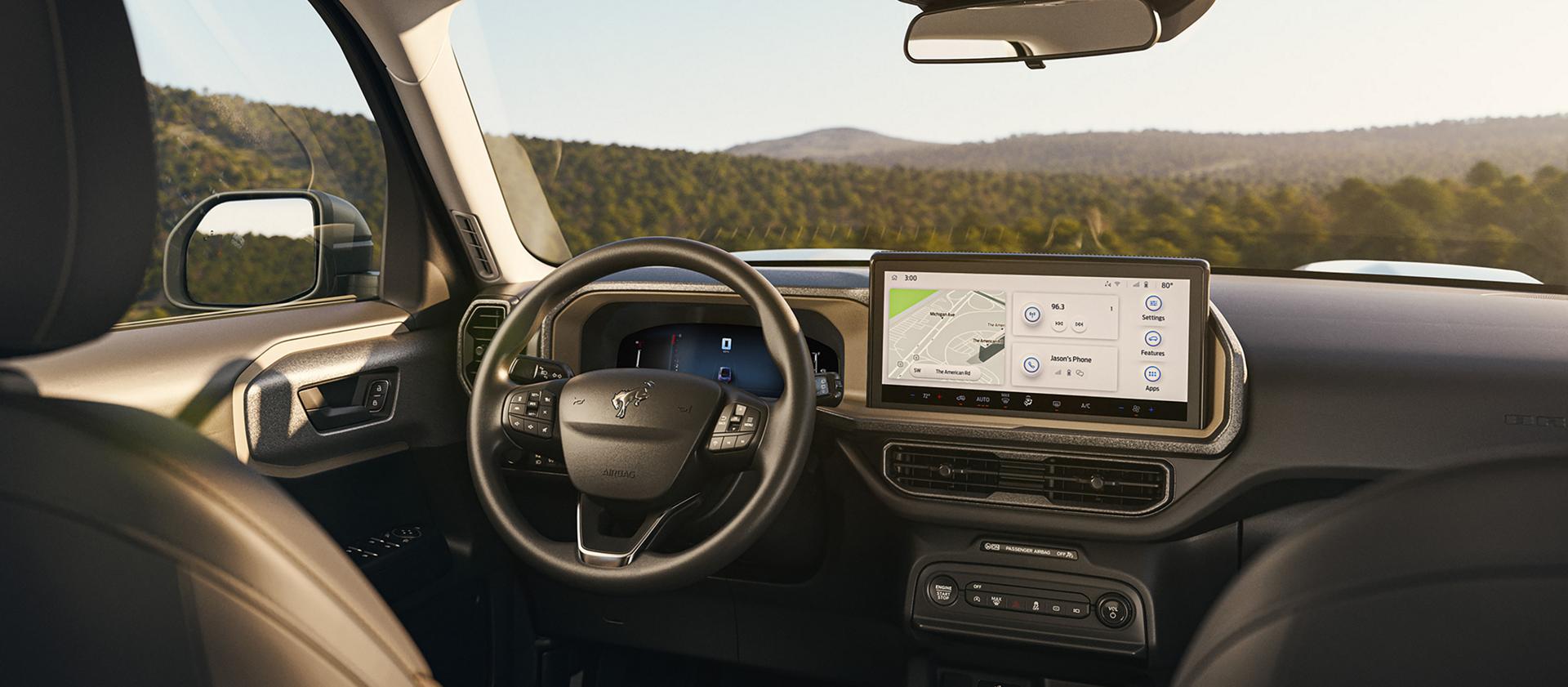 A 2026 Ford Bronco Sport® SUV interior showing the center console screen, steering wheel and driver's seat