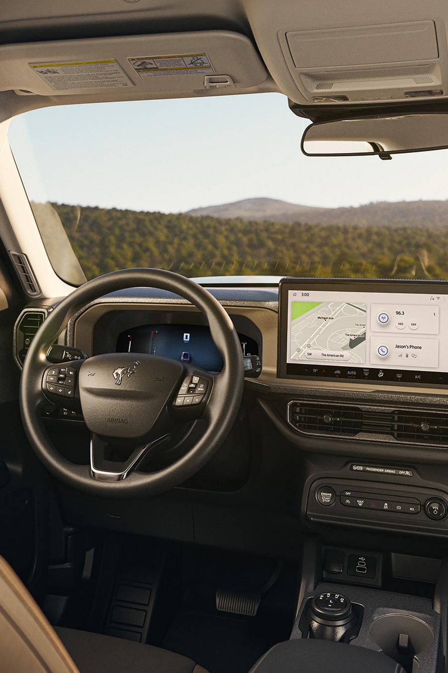 A 2026 Ford Bronco Sport® SUV interior showing the center console screen, steering wheel and driver's seat