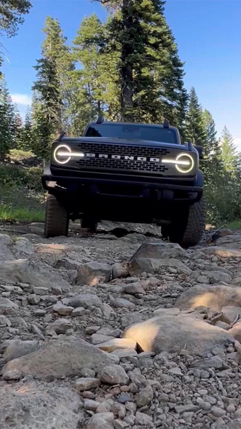 A 2026 Ford Bronco® SUV being driven on a rocky trail