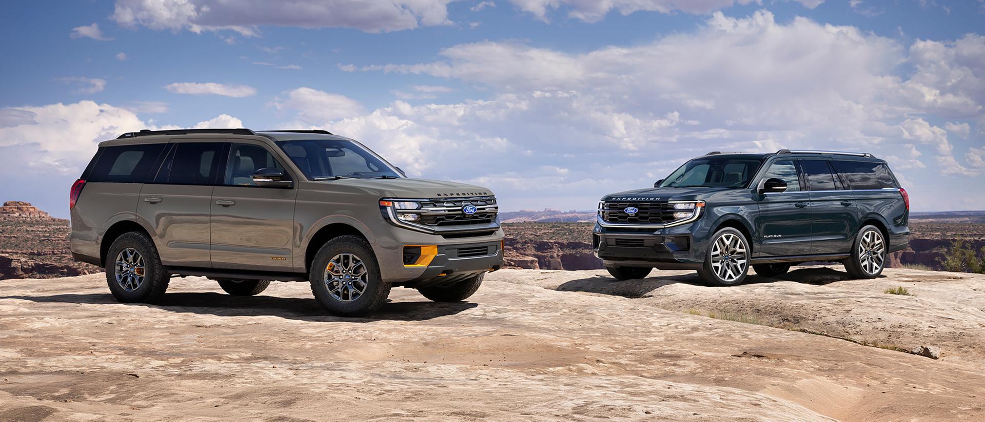 A 2027 Ford Expedition® Tremor® and another Expedition model parked on a rocky outcrop