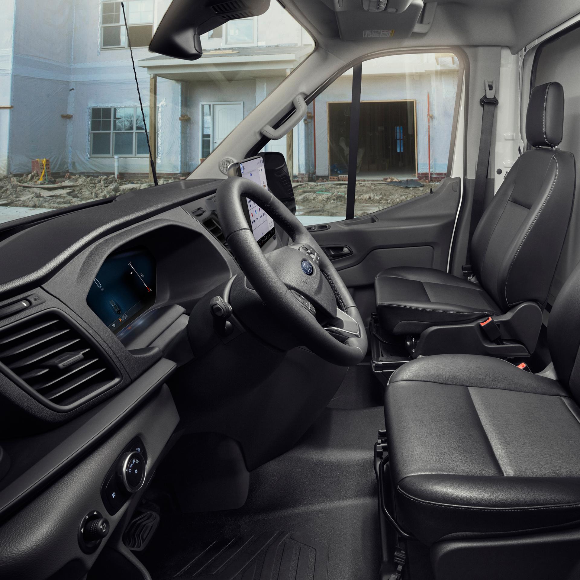 The interior of a 2026 Ford Transit® van driver's and passenger's seat