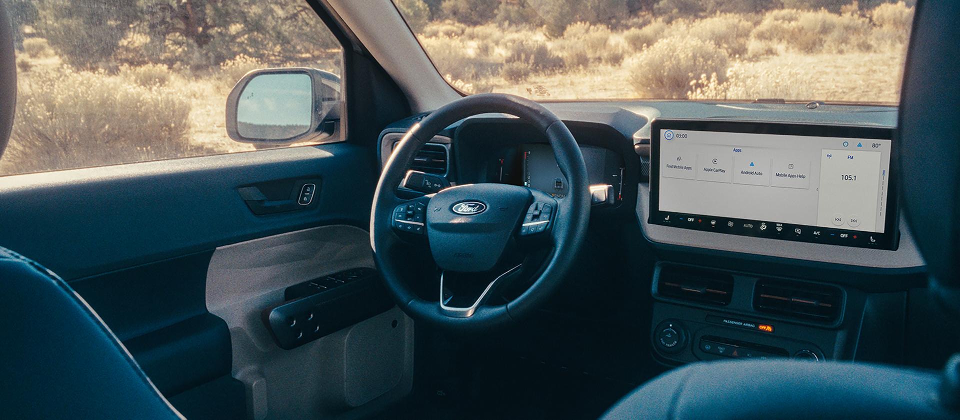Front interior of steering wheel and center display on a 2026 Ford Maverick® pickup