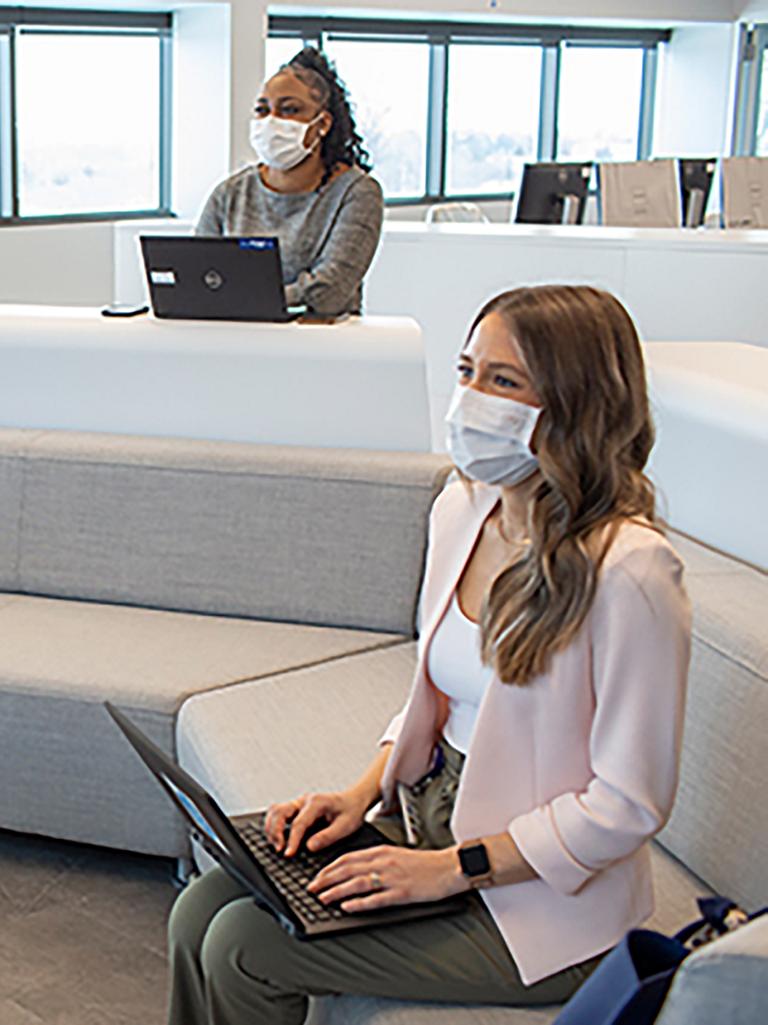 Three women sitting in office