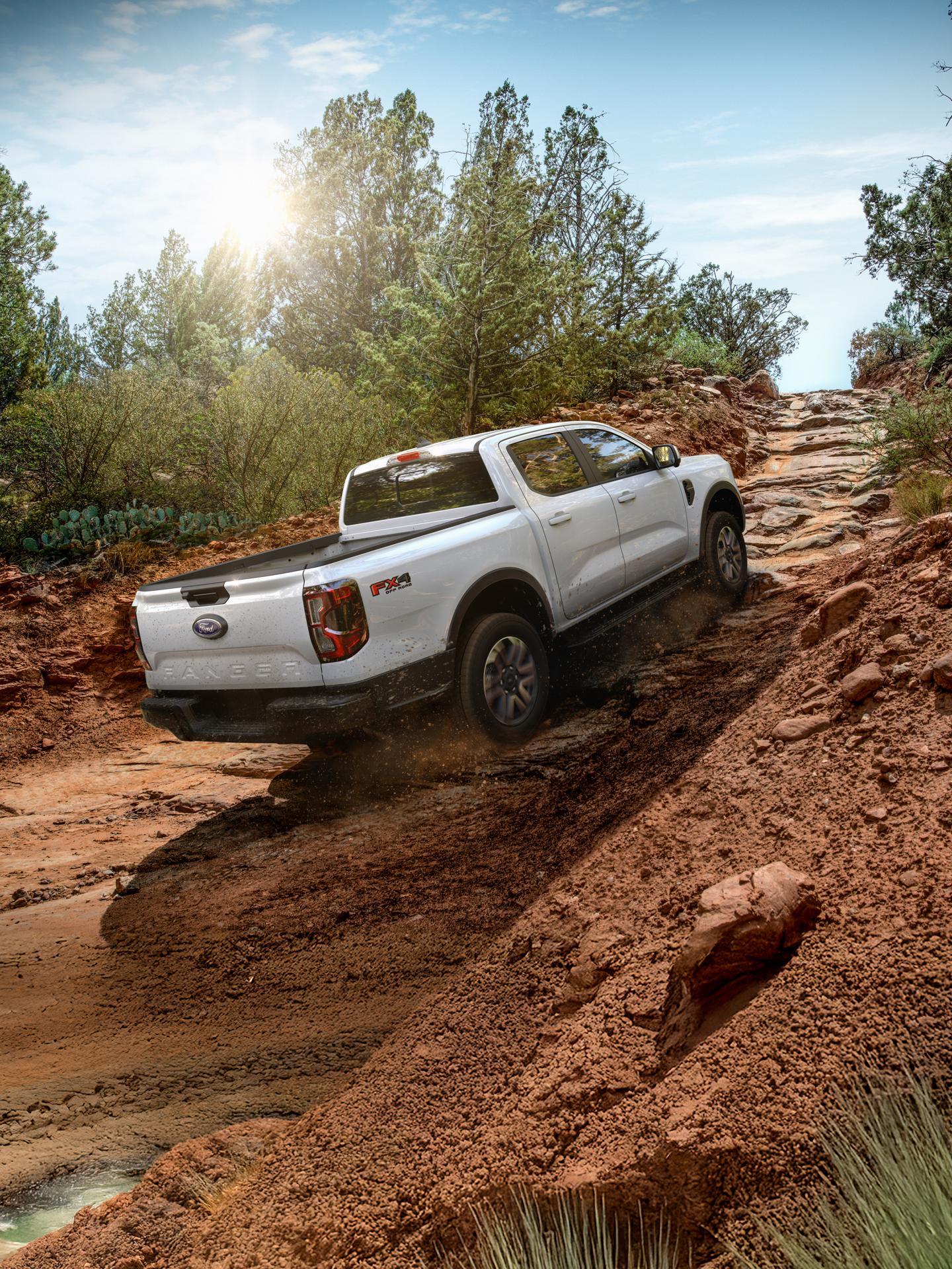 2026 Ford Ranger® Lariat® model with the FX4® Off-Road Package driving up a steep hill