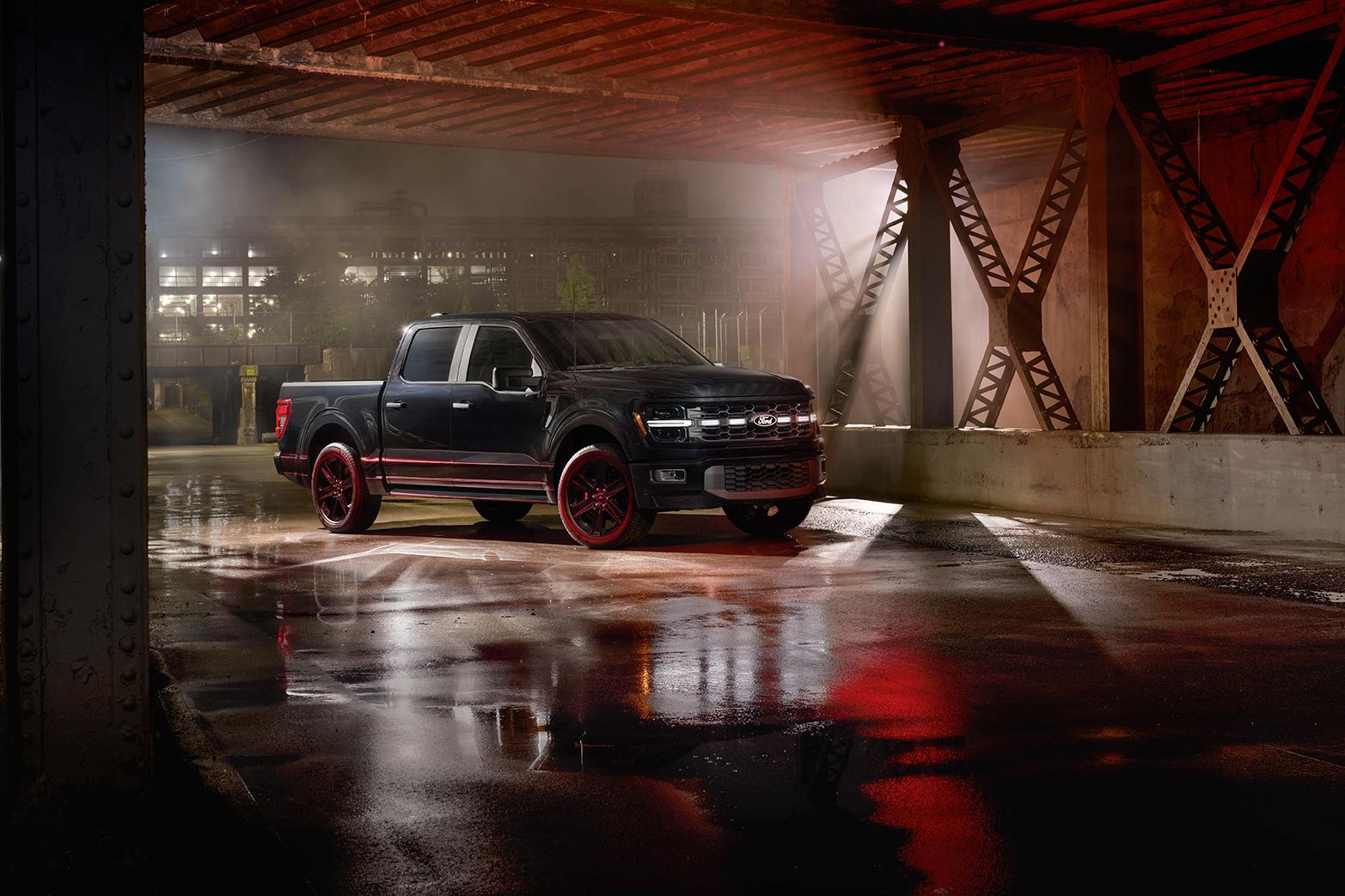 An F-150® truck in a dark parking structure at night