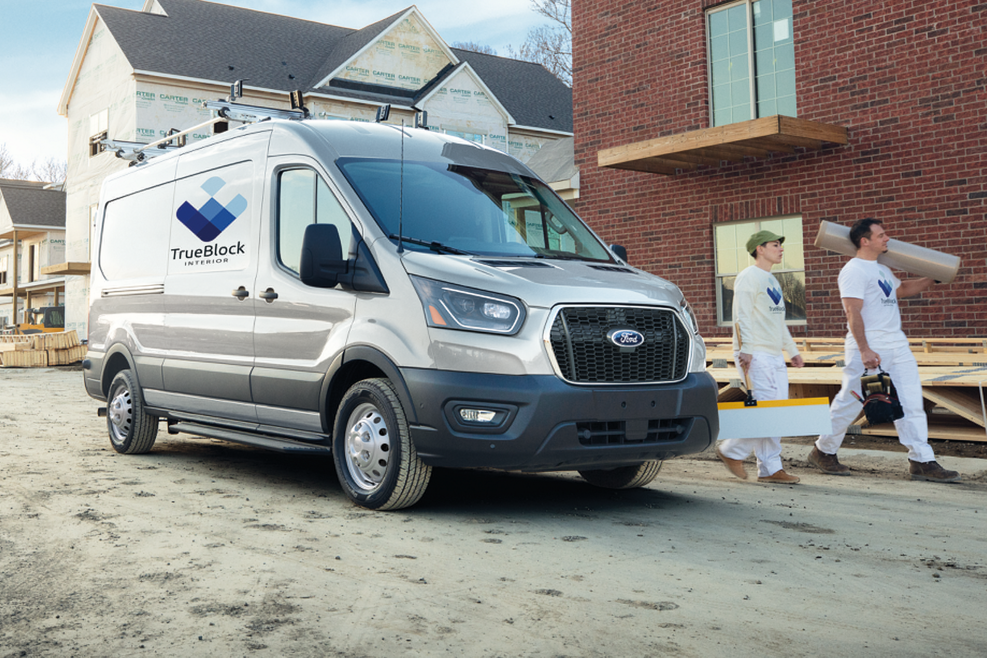 Silver 2026 Ford Transit® Commercial van parked at a job site
